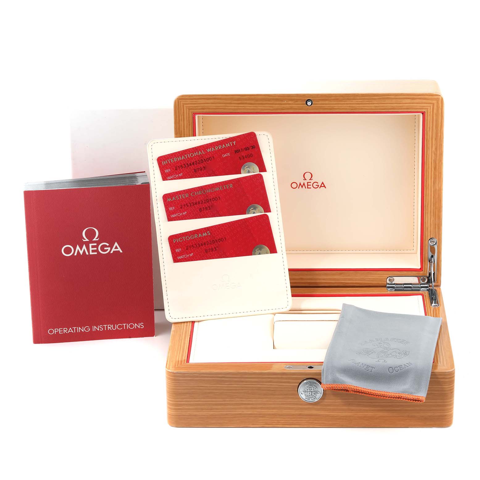 The image shows the Omega Planet Ocean 215.33.44.22.01.001 Men's Stainless Steel Black Dial 215.33.44.22.01.001 Men's Stainless Steel Black Dial watch accessories: a wooden box, warranty cards, manual, and cleaning cloth.