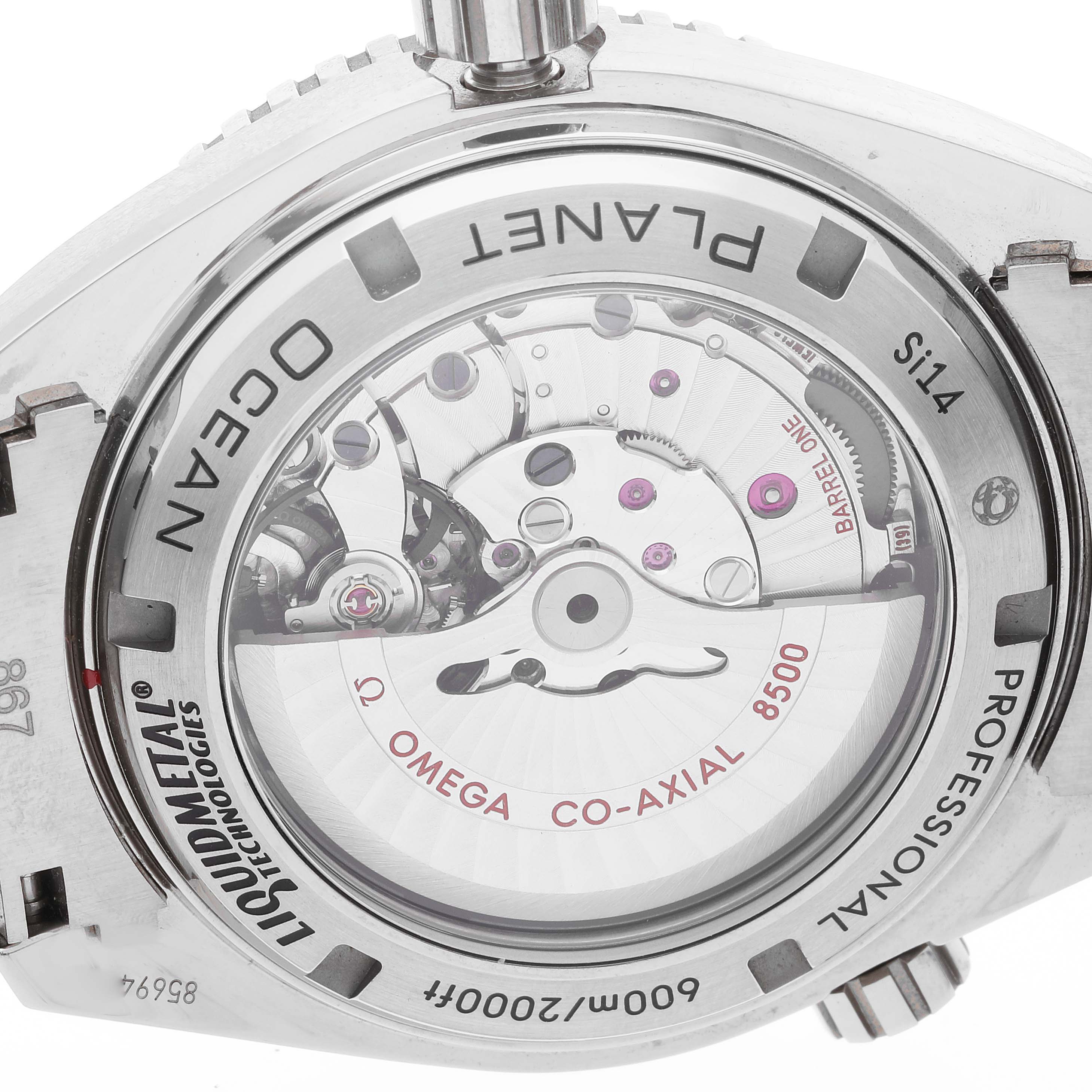 The image shows the back view of an Omega Planet Ocean 232.90.46.21.03.001 Men's Titanium Blue Dial 232.90.46.21.03.001 Men's Titanium Blue Dial watch, highlighting its movement and engravings.