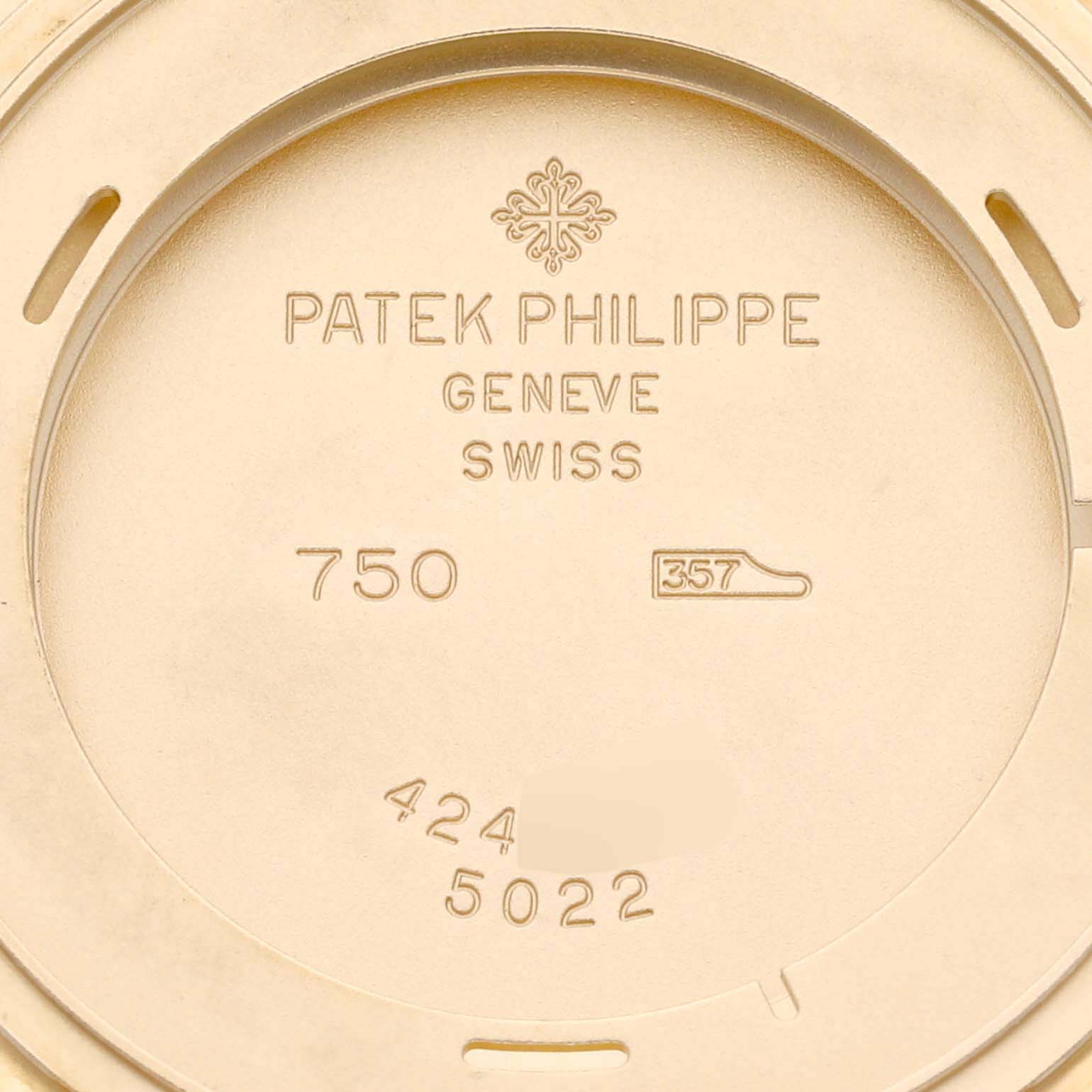 The image shows the inner case back of a Patek Philippe Calatrava 5022J Men's Yellow Gold White Dial 5022J Men's Yellow Gold White Dial watch, displaying the brand's engraving and hallmarks.