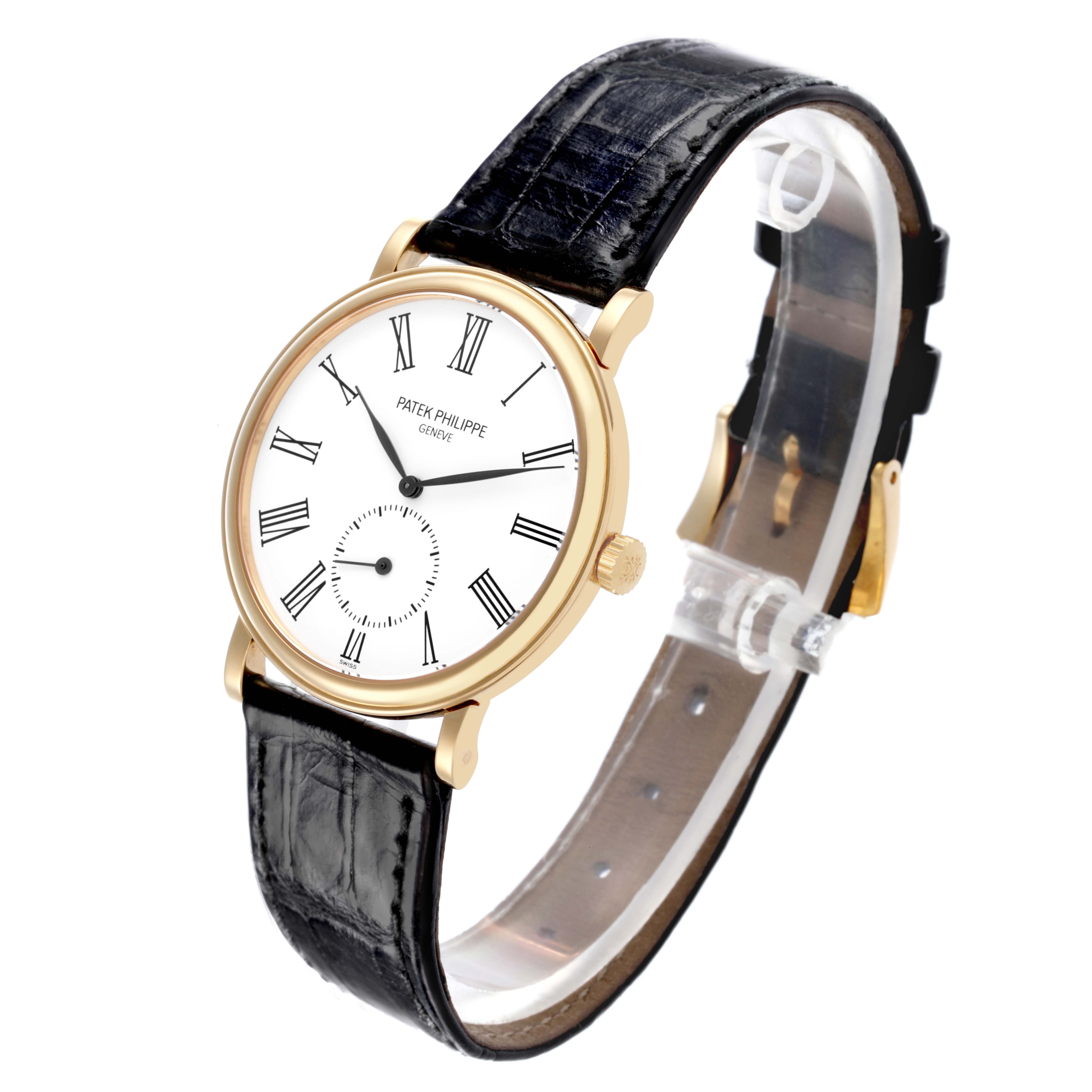 The Patek Philippe Calatrava 5022J Men's Yellow Gold White Dial 5022J Men's Yellow Gold White Dial watch is shown at an angled side view, displaying the dial, case, crown, and leather strap.