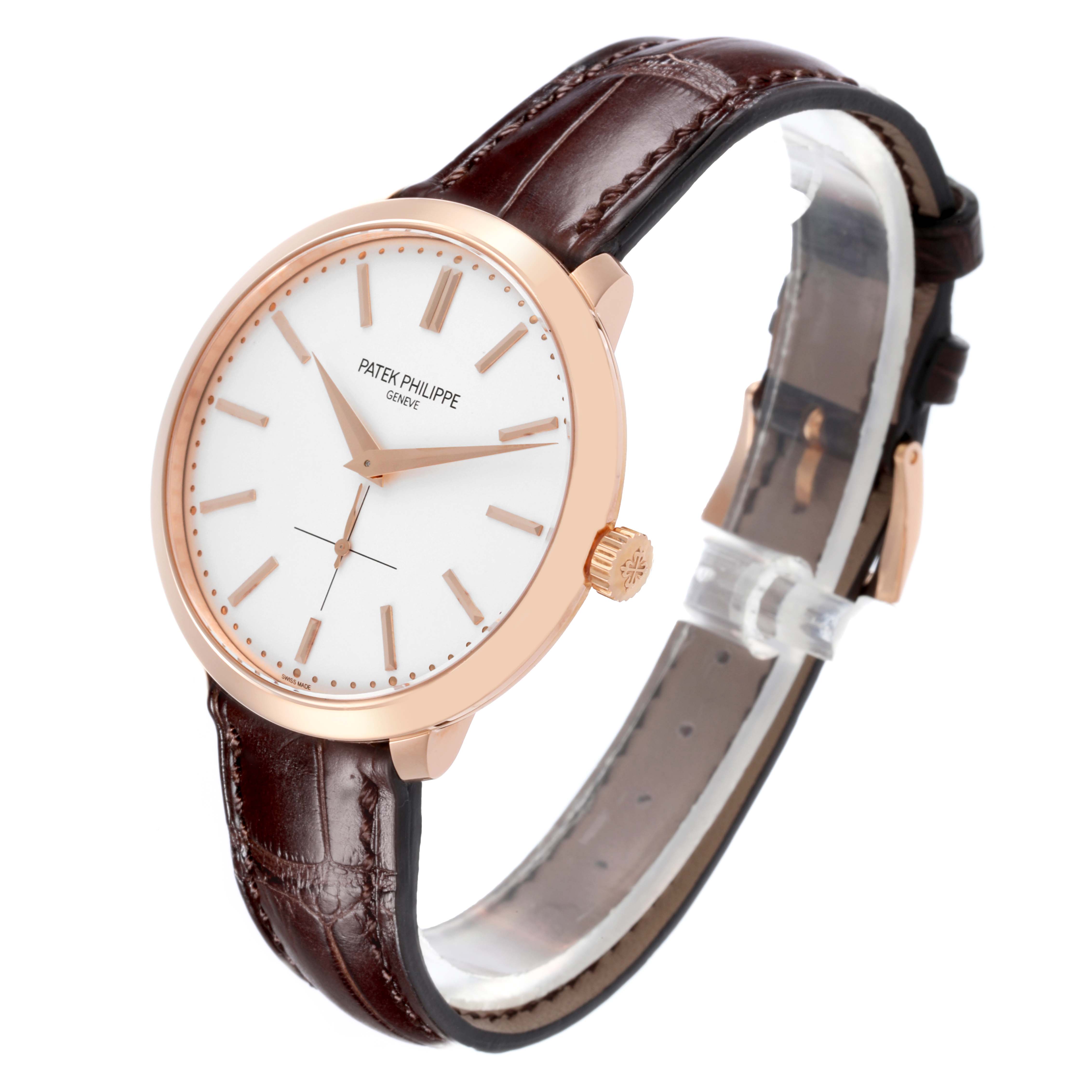 The Patek Philippe Calatrava 5123R Men's Rose Gold Silver Dial 5123R Men's Rose Gold Silver Dial watch is shown at a three-quarter angle, displaying the face, crown, and leather strap.