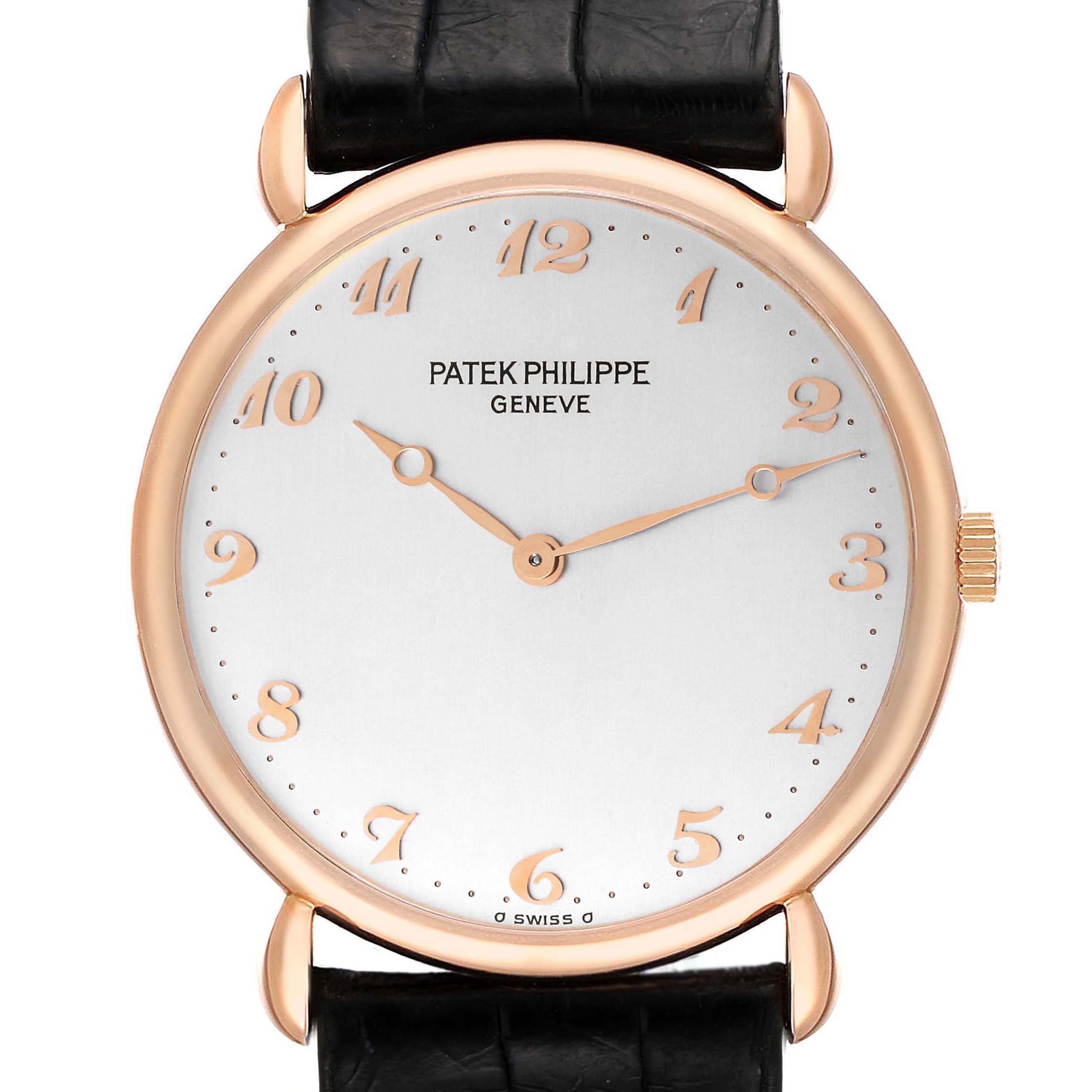 The image shows a straight-on view of the Patek Philippe Calatrava 3820 Men's Rose Gold Silver Dial 3820 Men's Rose Gold Silver Dial watch, highlighting its dial, hands, and part of the strap.