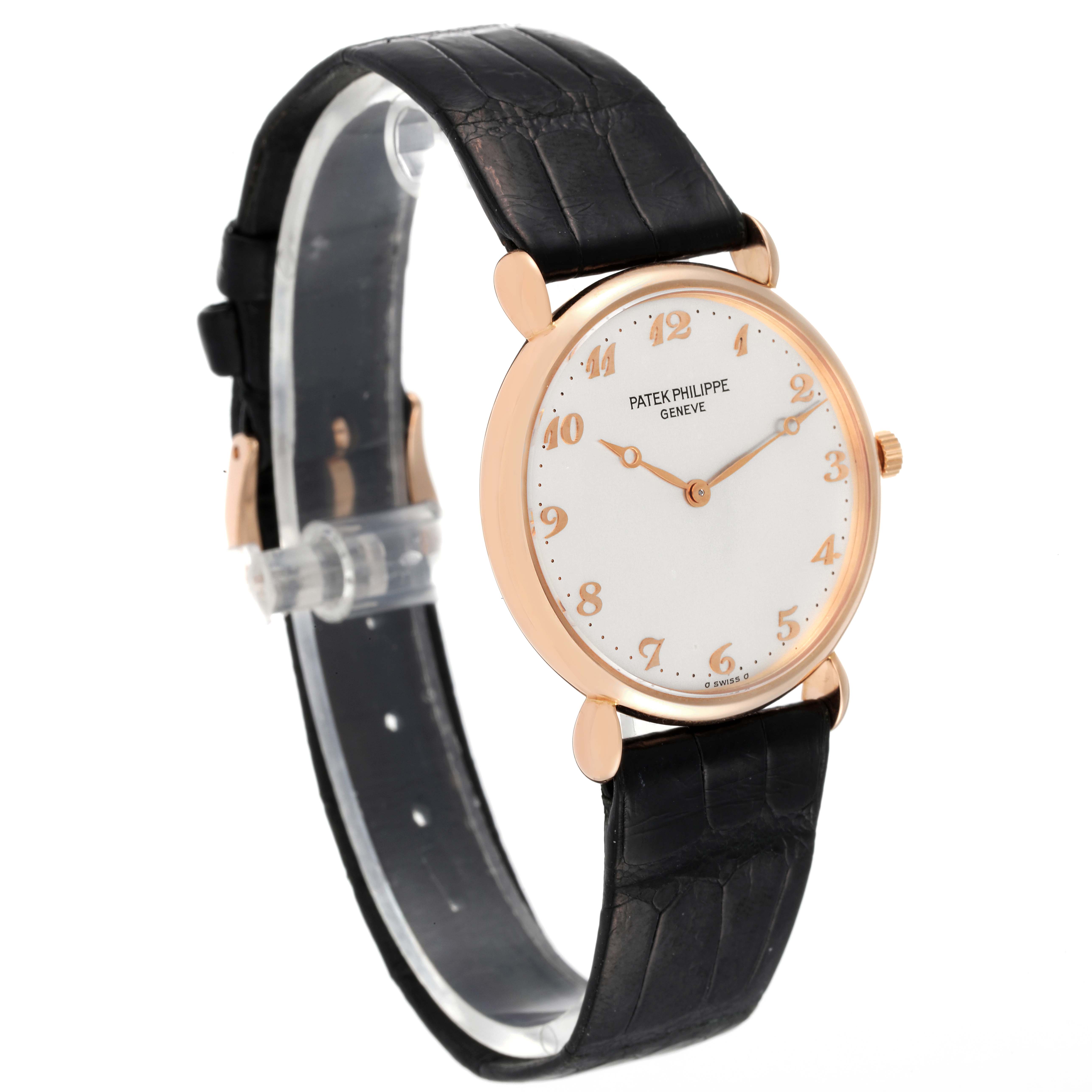 This image displays a Vintage Patek Philippe watch angled from the front-left side, showcasing the dial, strap, and crown.