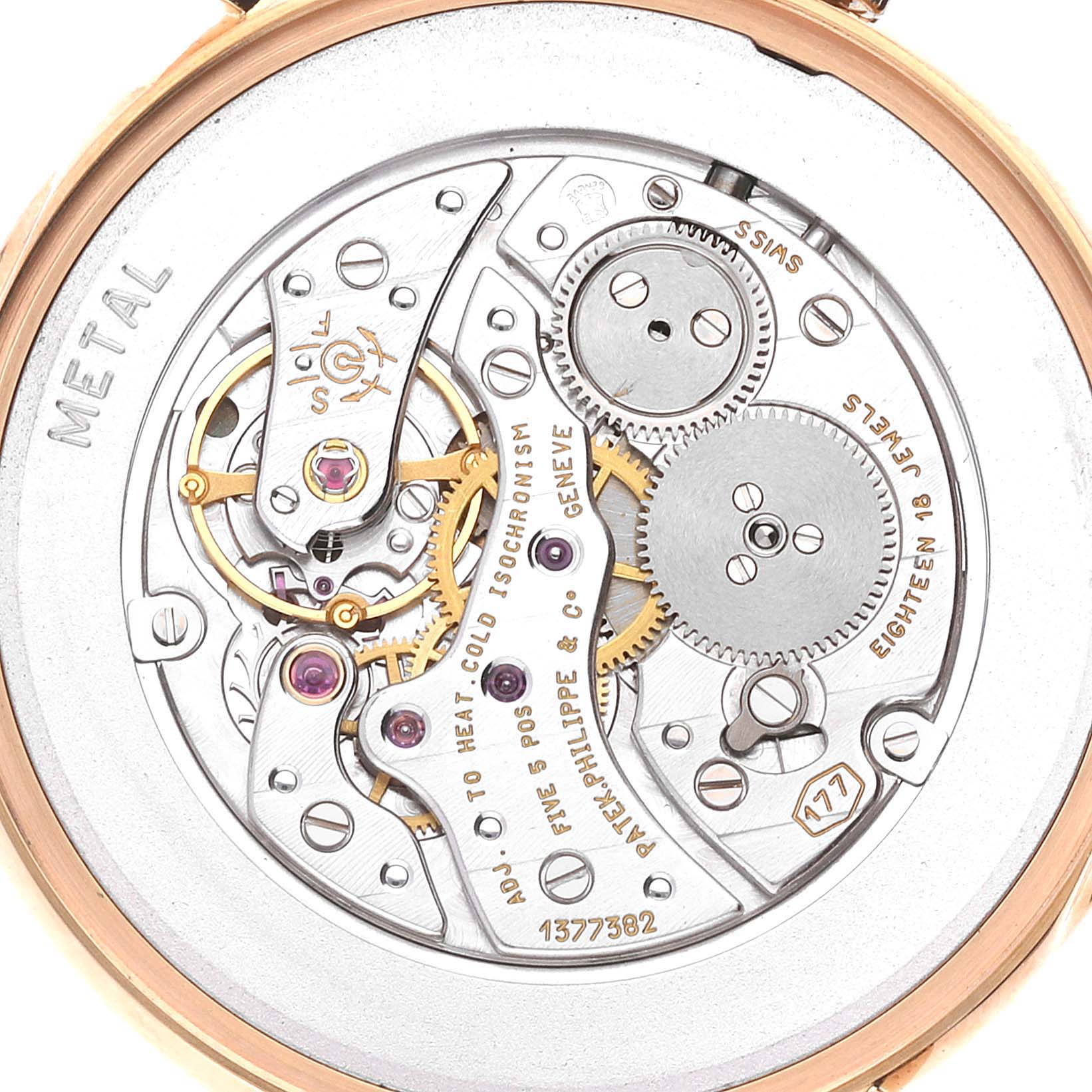 The image shows the inner mechanical movement of a Vintage Patek Philippe watch, viewed from the back.