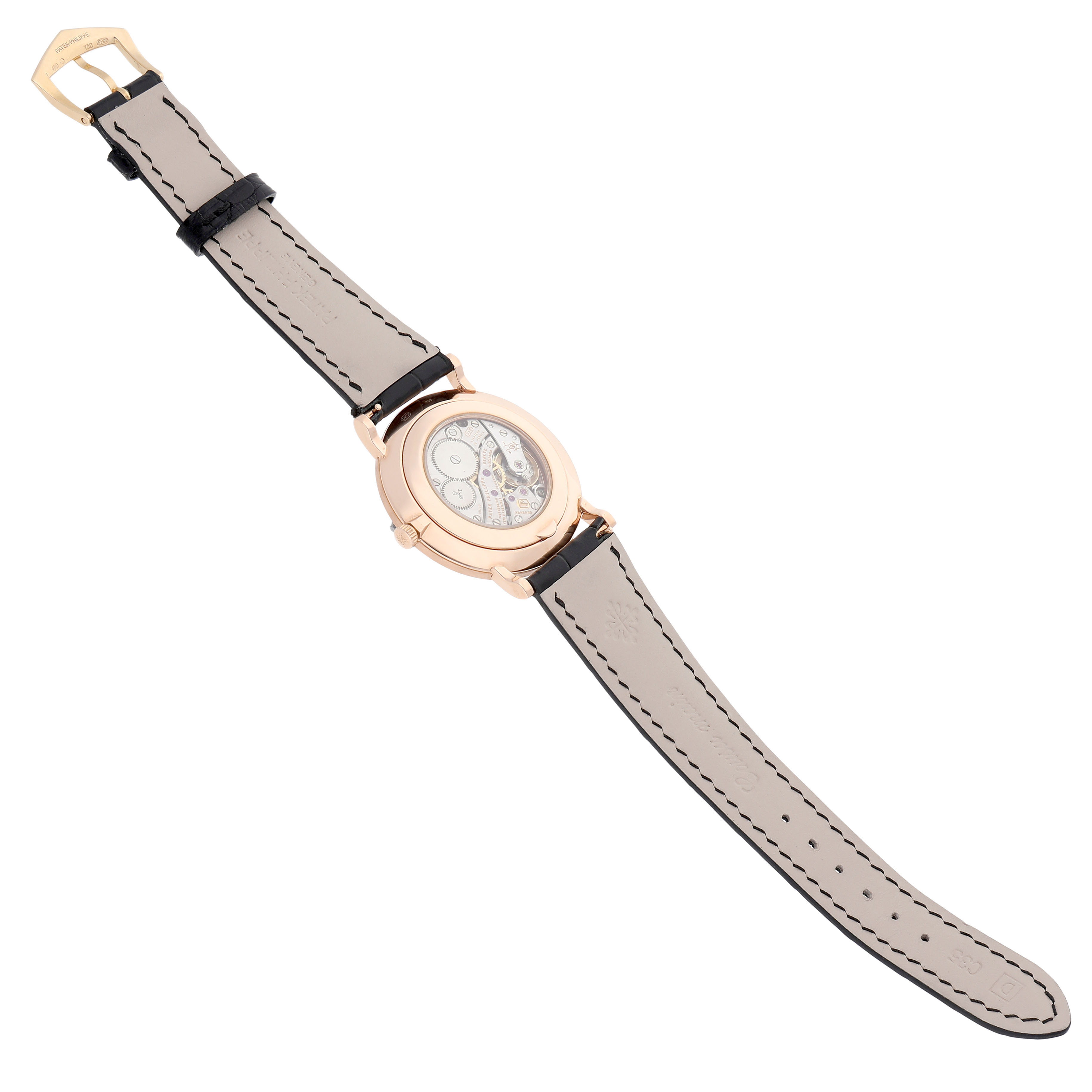 The Patek Philippe Calatrava 5119R-001 Men's Rose Gold White Dial watch is shown from the back, highlighting its mechanical movement and leather strap.