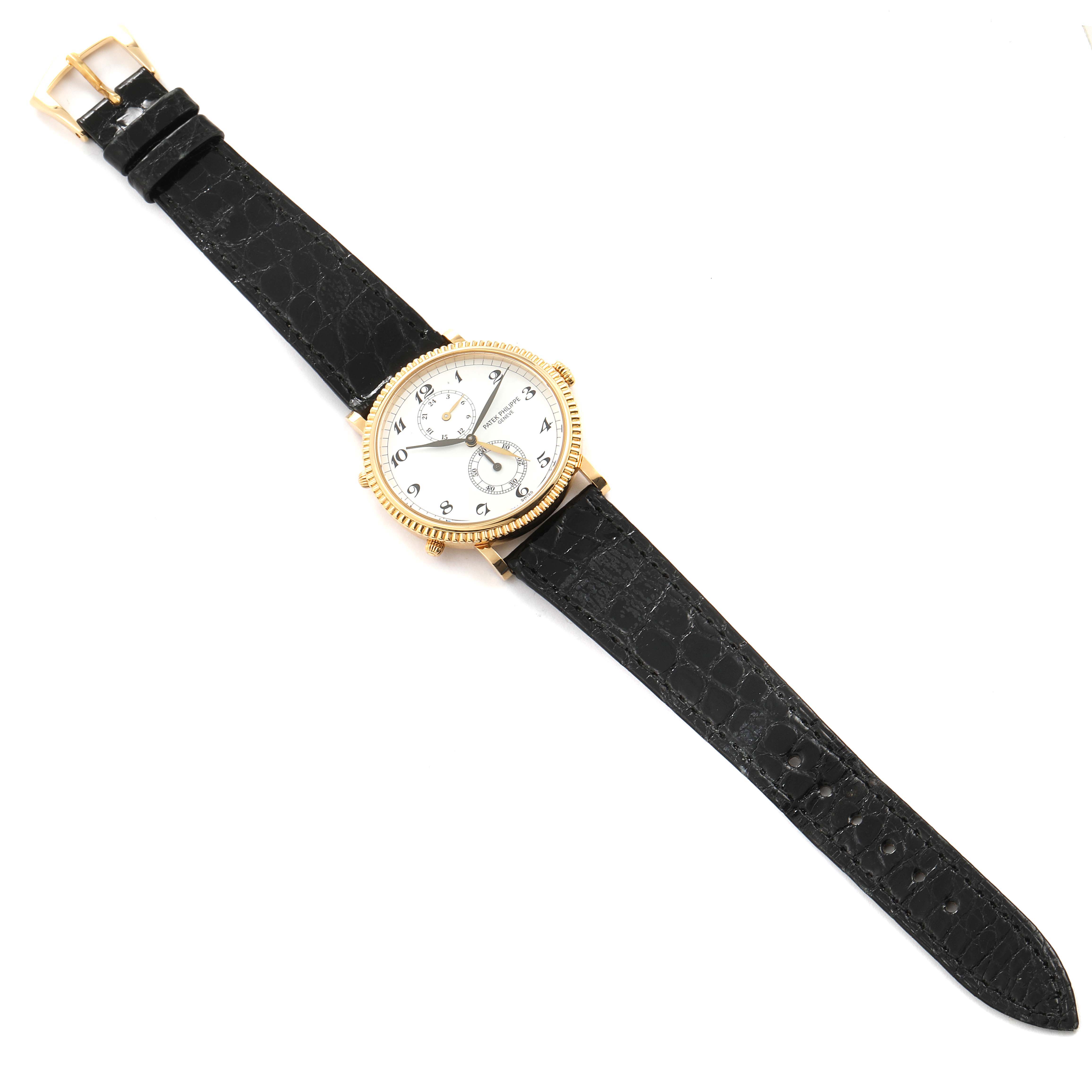 The image shows a Patek Philippe Calatrava 5034J Men's Yellow Gold White Dial 5034J Men's Yellow Gold White Dial watch, featuring its face, bezel, and black leather strap, viewed from a top-down angle.