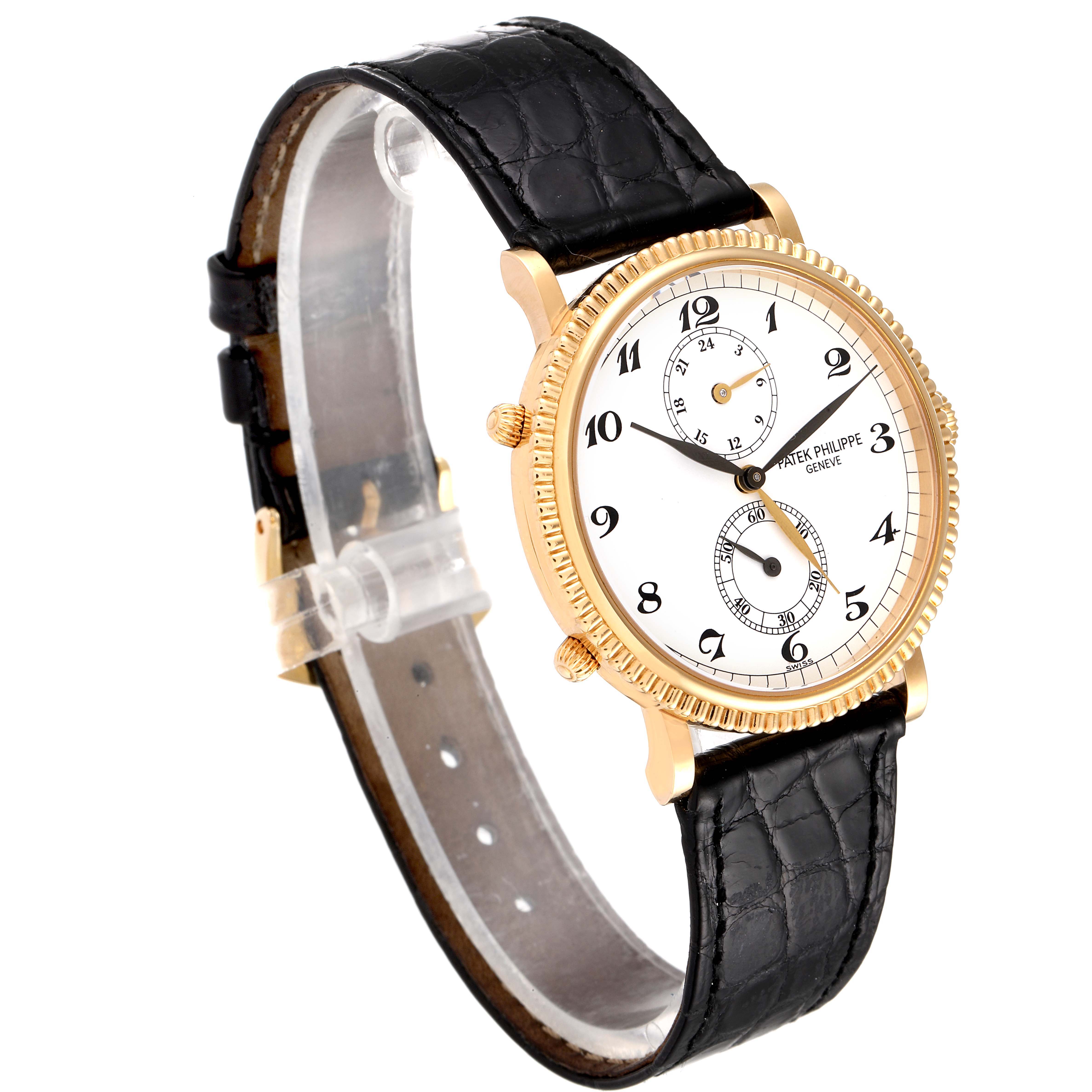 This Patek Philippe Calatrava 5034J Men's Yellow Gold White Dial 5034J Men's Yellow Gold White Dial watch is shown at an oblique angle, displaying its face, black leather strap, and gold bezel.