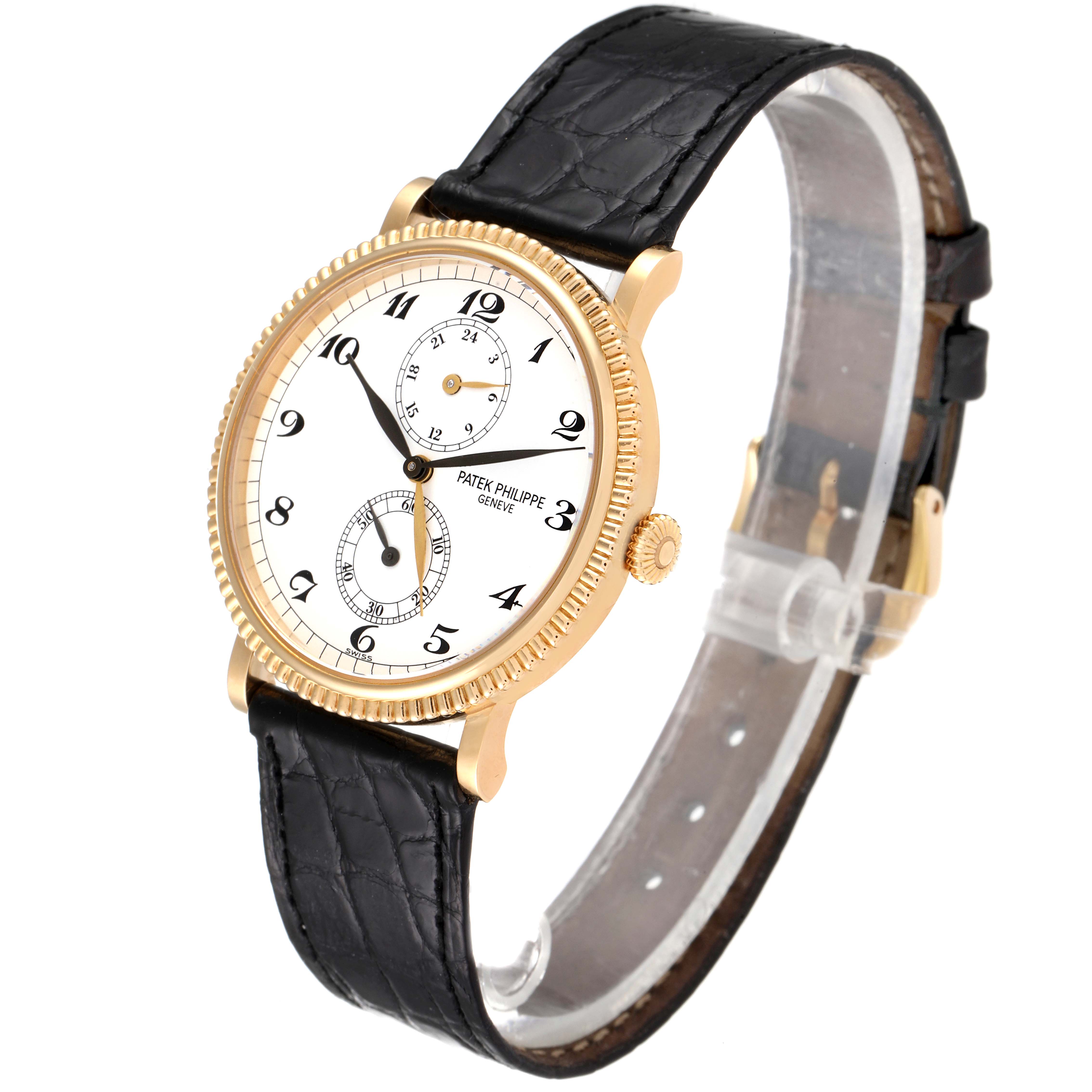 This image shows a Patek Philippe Calatrava 5034J Men's Yellow Gold White Dial 5034J Men's Yellow Gold White Dial watch from an angled side view, highlighting the dial, bezel, crown, and black leather strap.