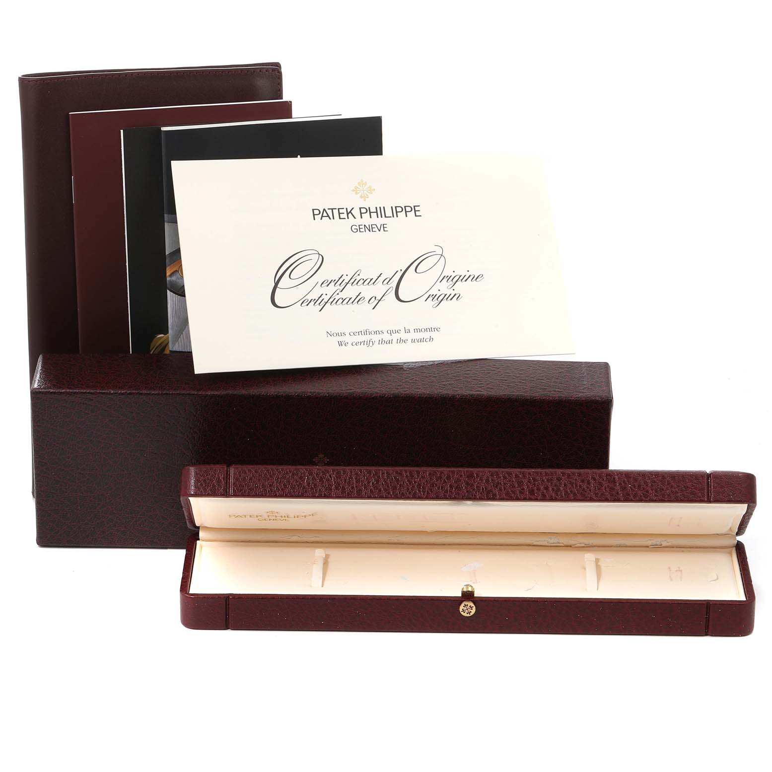 The image shows the packaging, booklets, and Certificate of Origin for a Patek Philippe Calatrava 5034J Men's Yellow Gold White Dial 5034J Men's Yellow Gold White Dial model, with the box open.