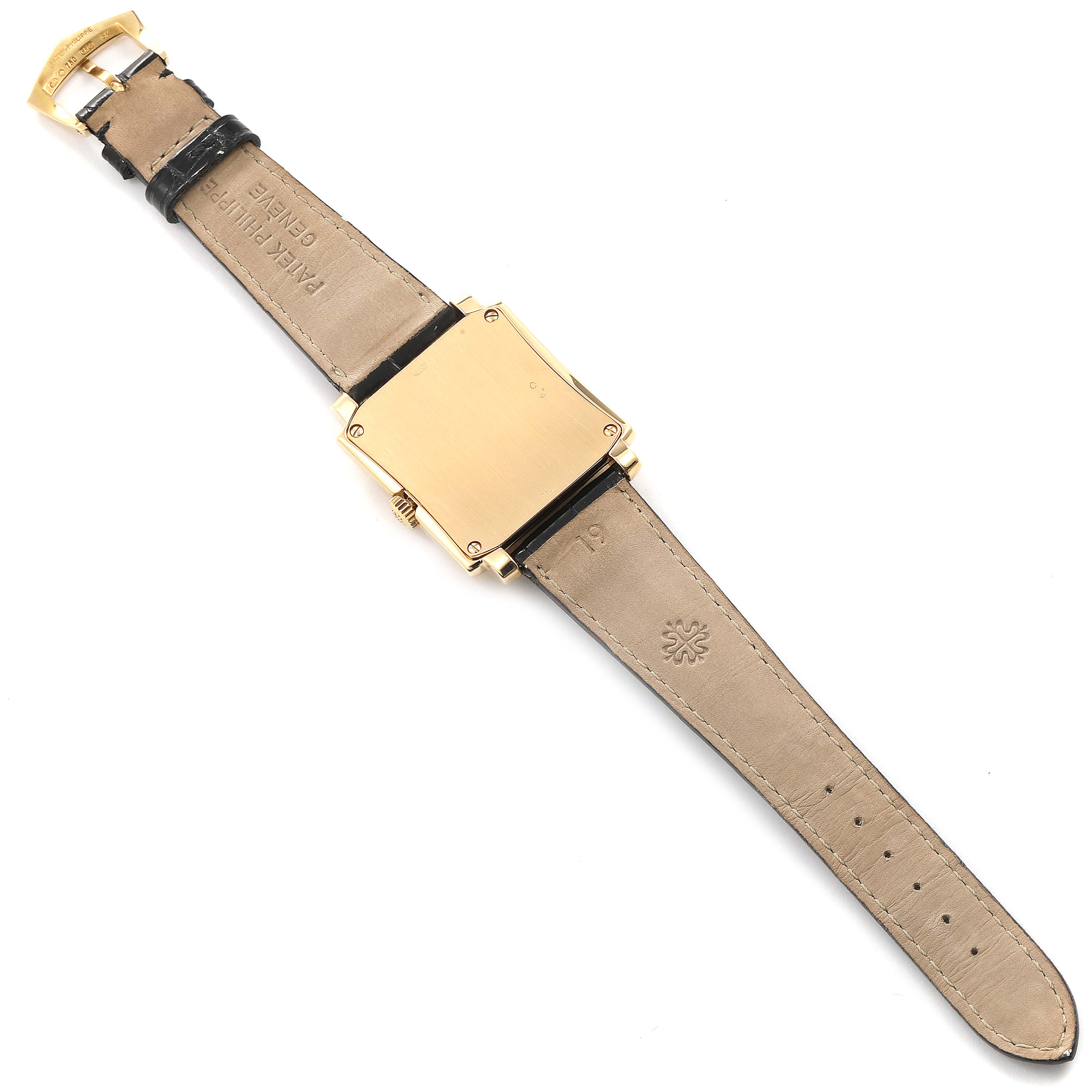 The image shows the back view of a Patek Philippe Gondolo 5024J Men
s Yellow Gold Silver Dial 5024J Men
s Yellow Gold Silver Dial watch, highlighting the leather strap and case back.