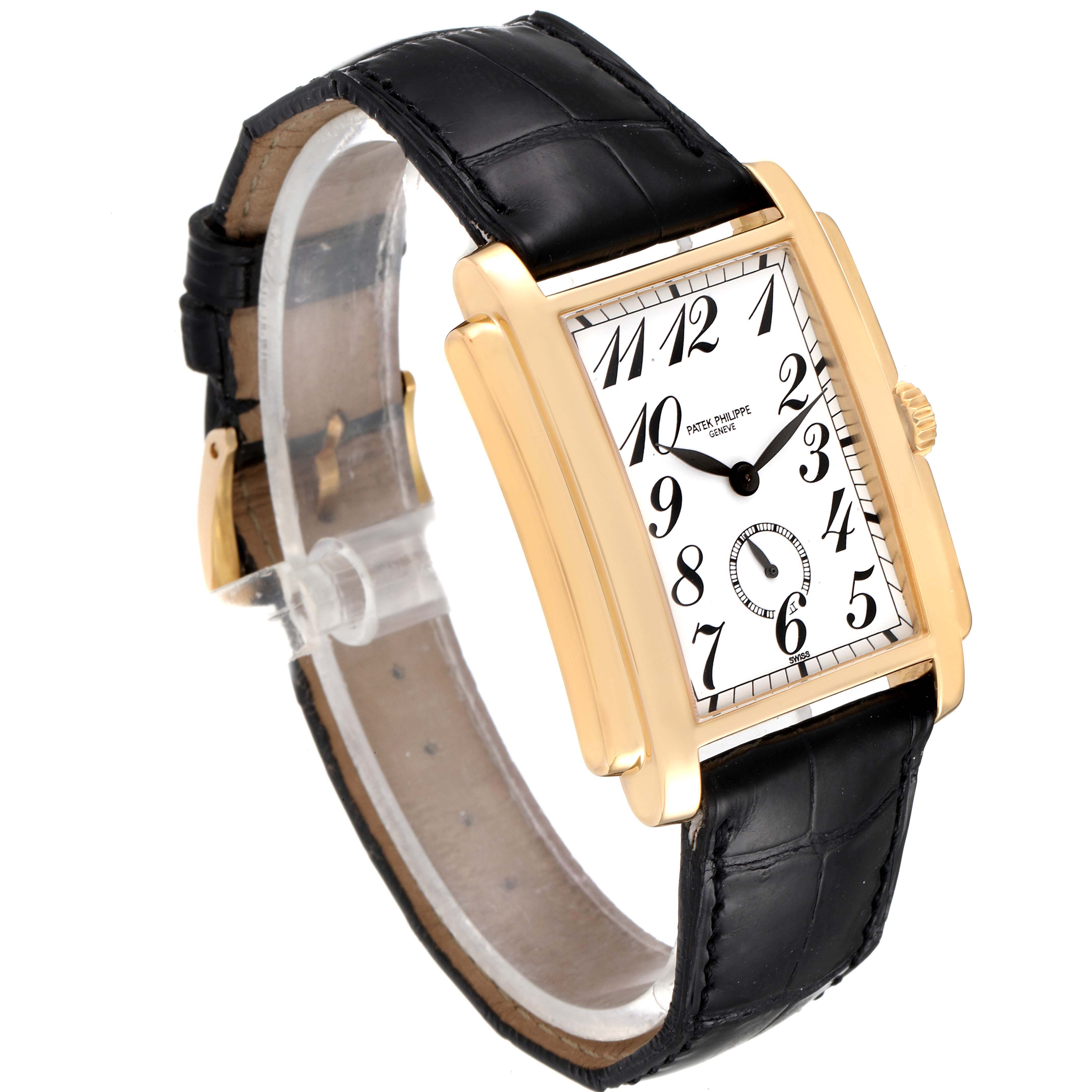 The Patek Philippe Gondolo 5024J Men
s Yellow Gold Silver Dial 5024J Men
s Yellow Gold Silver Dial watch is shown at a three-quarter angle, highlighting its rectangular case, white dial, and black leather strap.