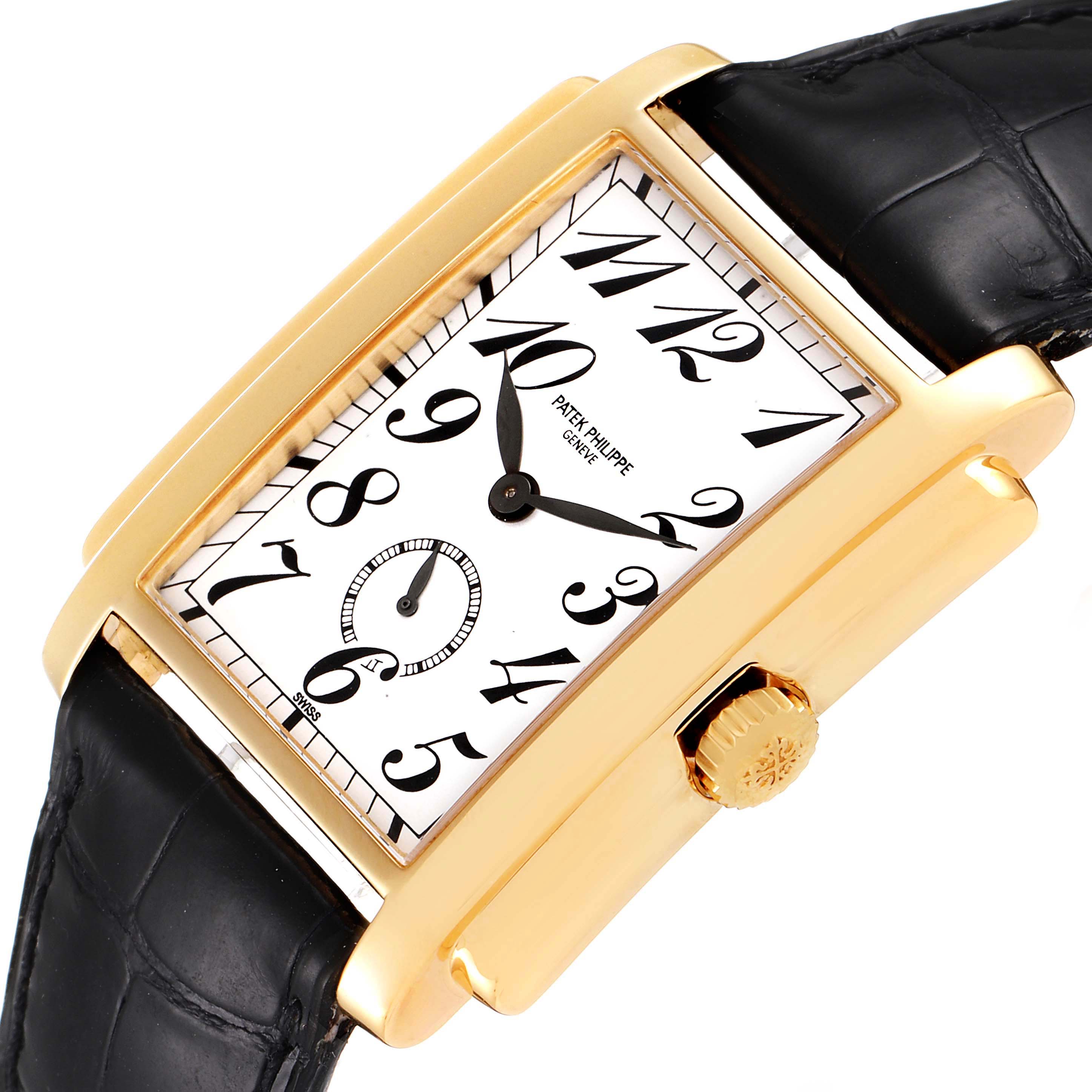 The image shows a close-up of the Patek Philippe Gondolo 5024J Men
s Yellow Gold Silver Dial 5024J Men
s Yellow Gold Silver Dial watch, highlighting its rectangular gold case, dial, and black leather strap.