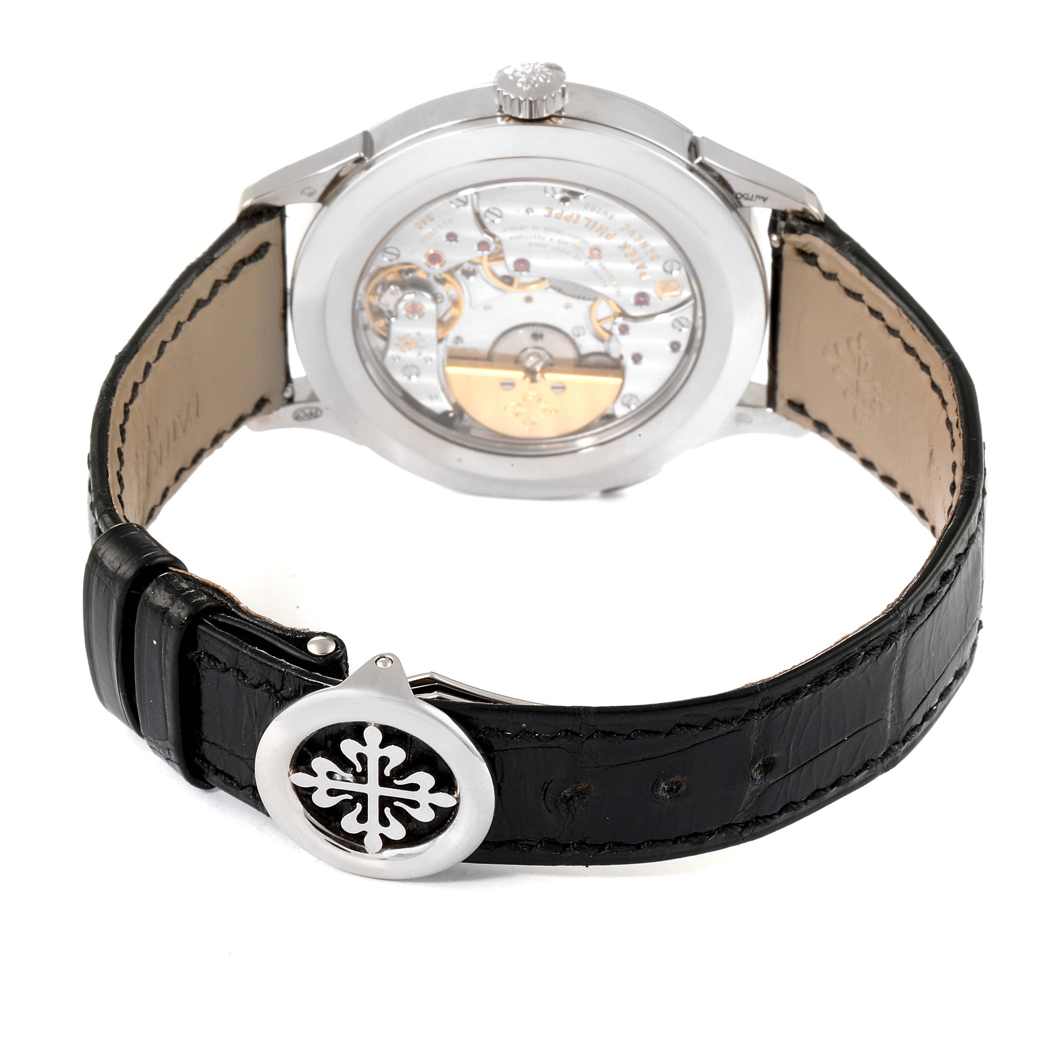 The image shows the back view of a Patek Philippe Complications 5110G Men's White Gold Grey Dial 5110G Men's White Gold Grey Dial watch, highlighting the movement and leather strap.