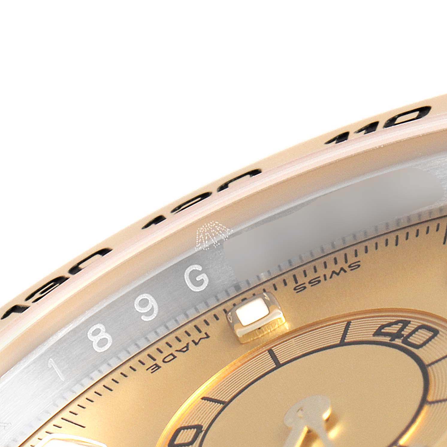 This close-up image of the Rolex Daytona 116503 Men's Steel and Gold (two tone) Champagne Dial 116503 Men's Steel and Gold (two tone) Champagne Dial watch shows a portion of the bezel, dial, and markers.