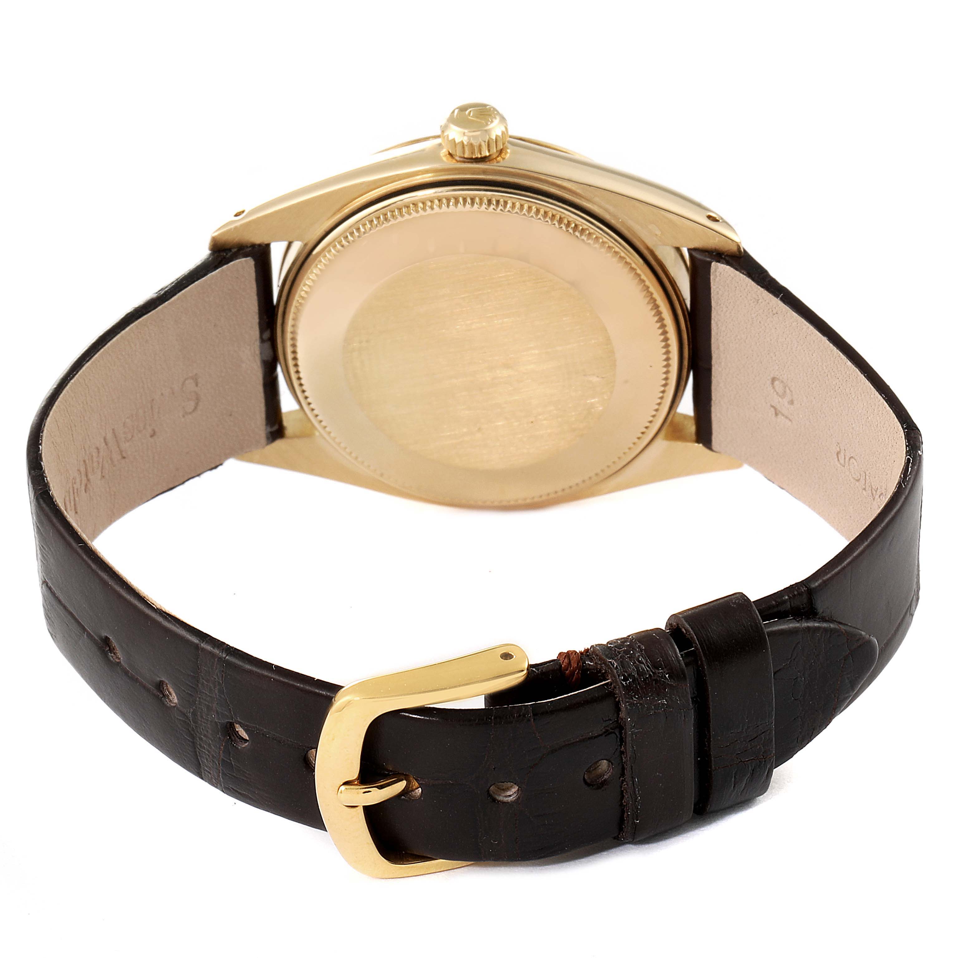 The image shows the backside and leather strap of a Vintage Collection model by Rolex.