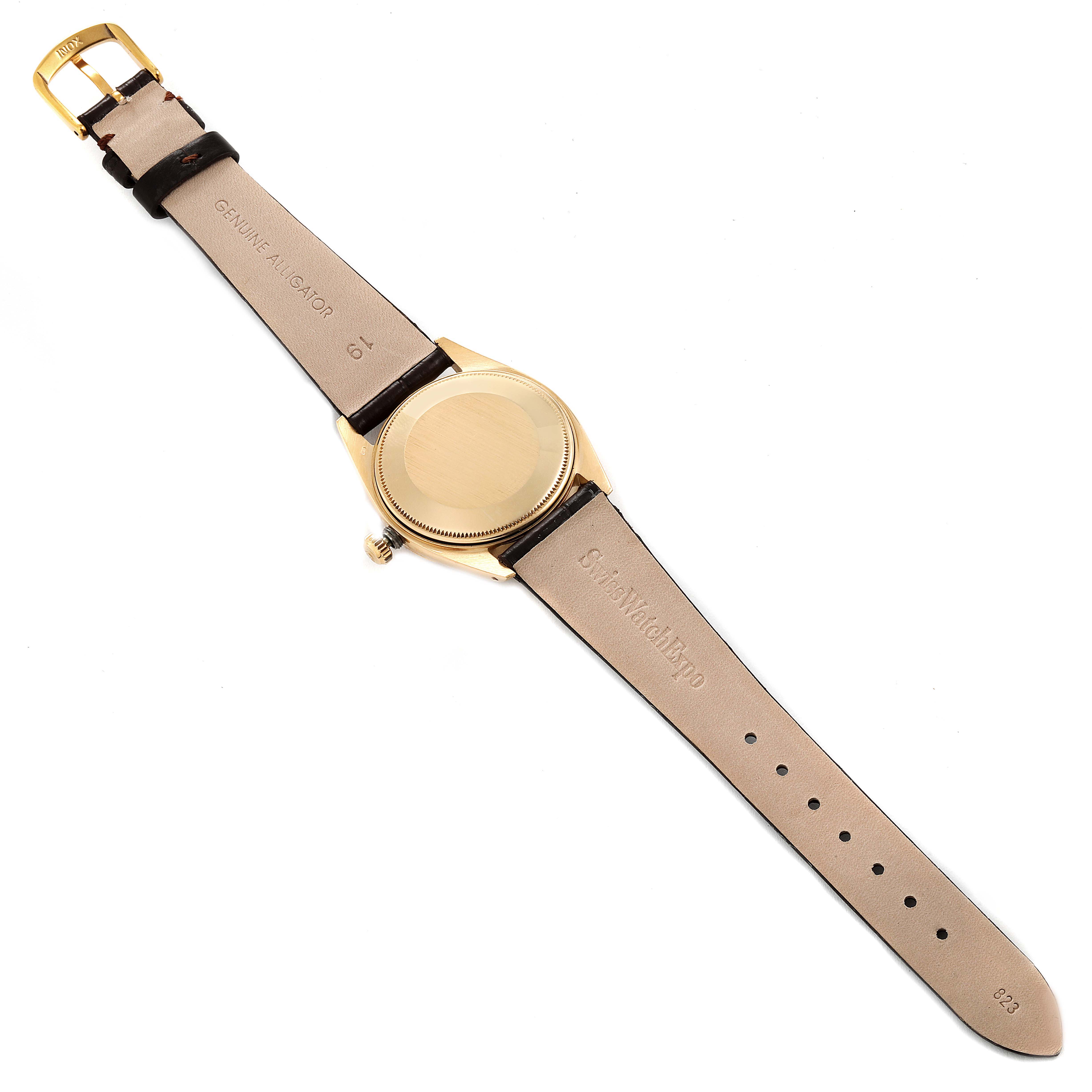 The image shows the back view of a Vintage Collection model watch by Rolex, highlighting the watch case and leather strap.