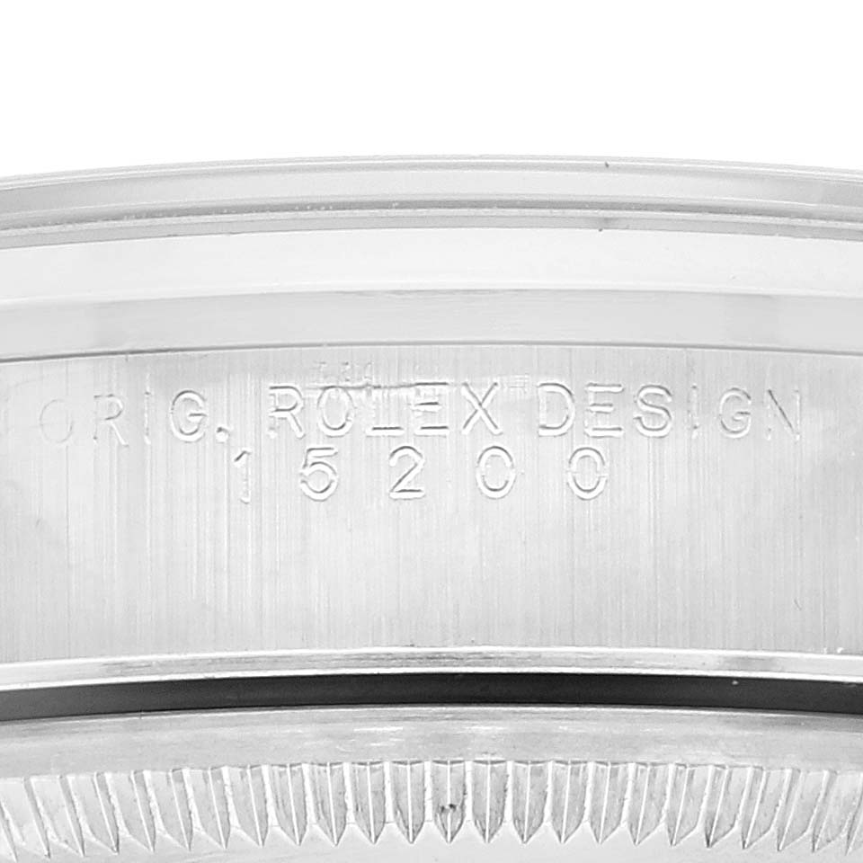 This close-up image shows the side engraving and bezel of a Rolex Date 15200 Men
s Stainless Steel White Dial 15200 Men
s Stainless Steel White Dial model, specifically the 15200 Design.