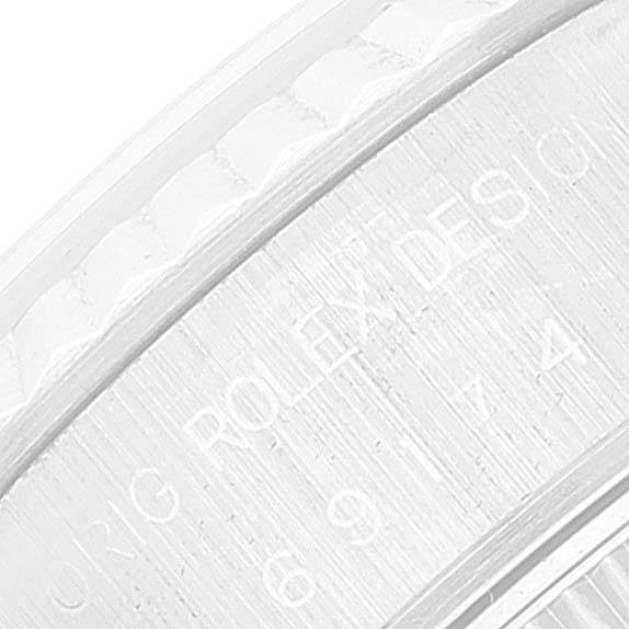 This image shows a close-up of an engraved section on the caseback of a Rolex Datejust 69174 Women's Stainless Steel Pink Dial 69174 Women's Stainless Steel Pink Dial watch.