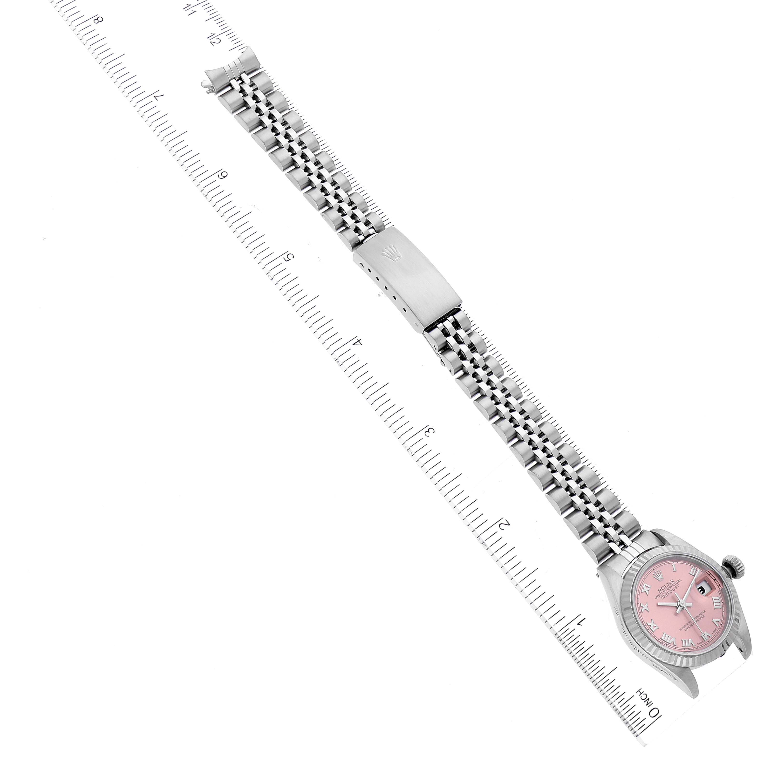 The image shows a top view of a Rolex Datejust 69174 Women's Stainless Steel Pink Dial 69174 Women's Stainless Steel Pink Dial watch with a pink dial and a metal Jubilee bracelet.