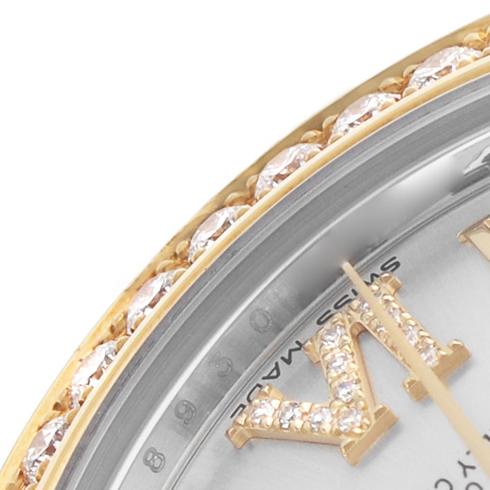 The image shows a close-up of the bezel and part of the dial with diamond hour markers on a Rolex Datejust 178383 Women's Steel and Gold (two tone) Silver Dial.