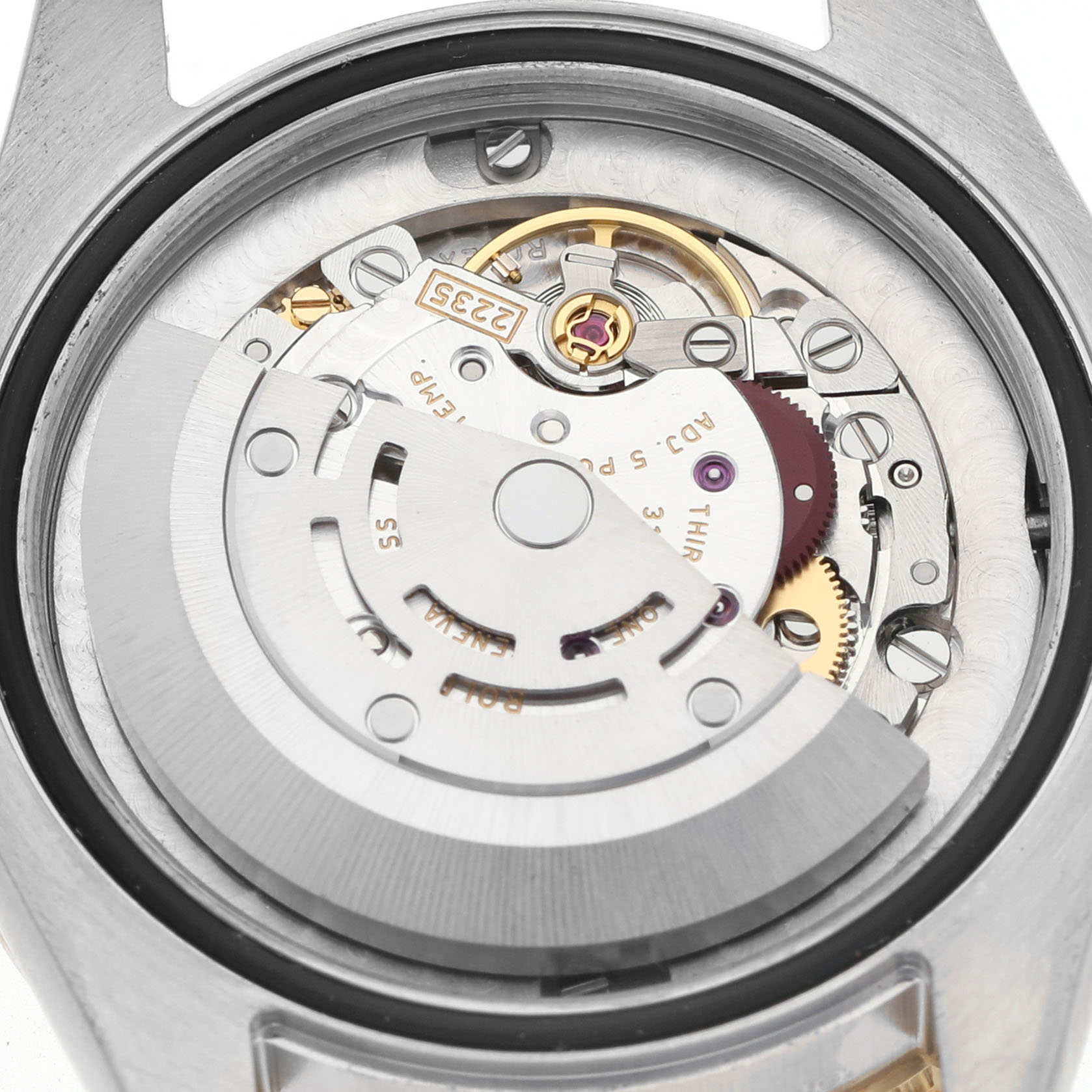 The image shows a close-up view of the Rolex Datejust 178383 Women's Steel and Gold (two tone) Silver Dial movement, highlighting gears and the rotor.