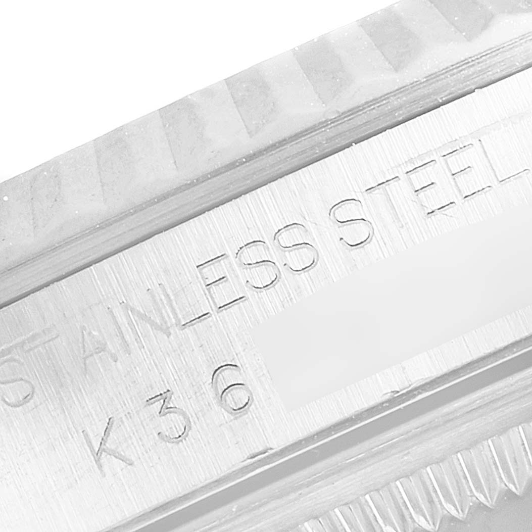 This image shows a close-up angle of the case back engraving of a Rolex Datejust 16234 Men's Stainless Steel White Dial 16234 Men's Stainless Steel White Dial watch, highlighting the "STAINLESS STEEL" text.