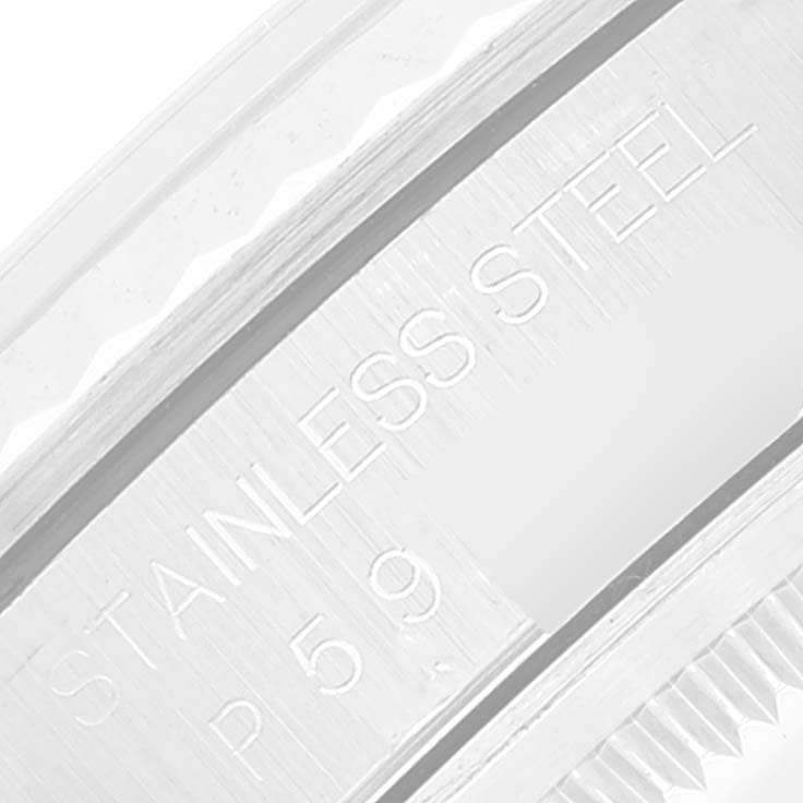 This image shows a close-up of the engraved text on the stainless steel frame of a Rolex Datejust 16234 Men's Stainless Steel Silver Dial 16234 Men's Stainless Steel Silver Dial watch.