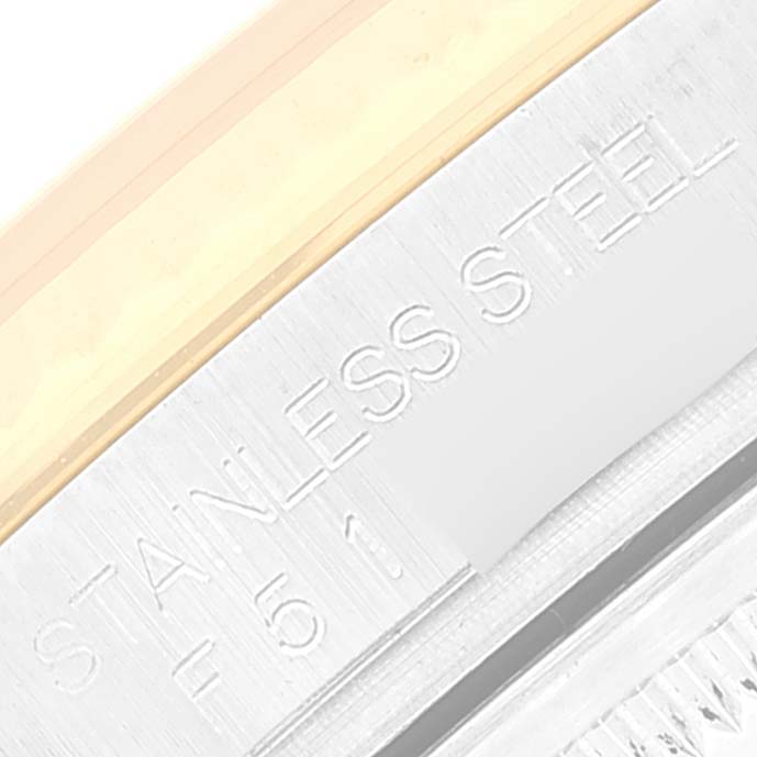 This image shows a close-up of the stainless steel case side, with the "STAINLESS STEEL" engraving of a Rolex Datejust 116233 Men's Steel and Gold (two tone) Champagne Dial 116233 Men's Steel and Gold (two tone) Champagne Dial watch.