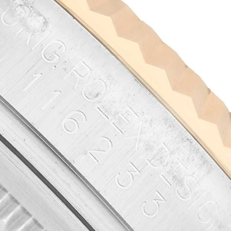 The image shows a close-up angle focused on the side of the bezel and case of the Rolex Datejust 116233 Men's Steel and Gold (two tone) White Dial watch, highlighting model engravings.