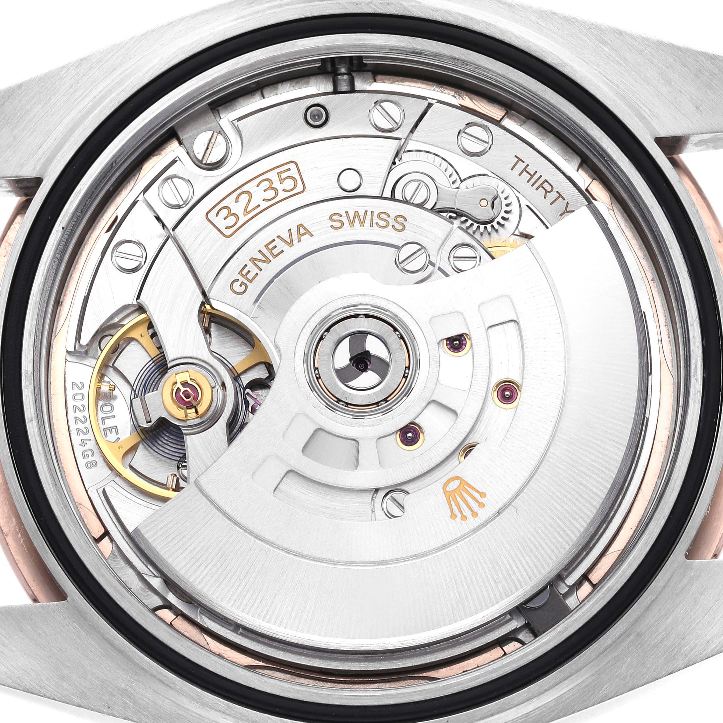 This image shows the movement of a Rolex Datejust 41 126301 Men's Steel and Gold (two tone) Pink Dial 126301 Men's Steel and Gold (two tone) Pink Dial, highlighting the intricate details of the calibre 3235 mechanism.