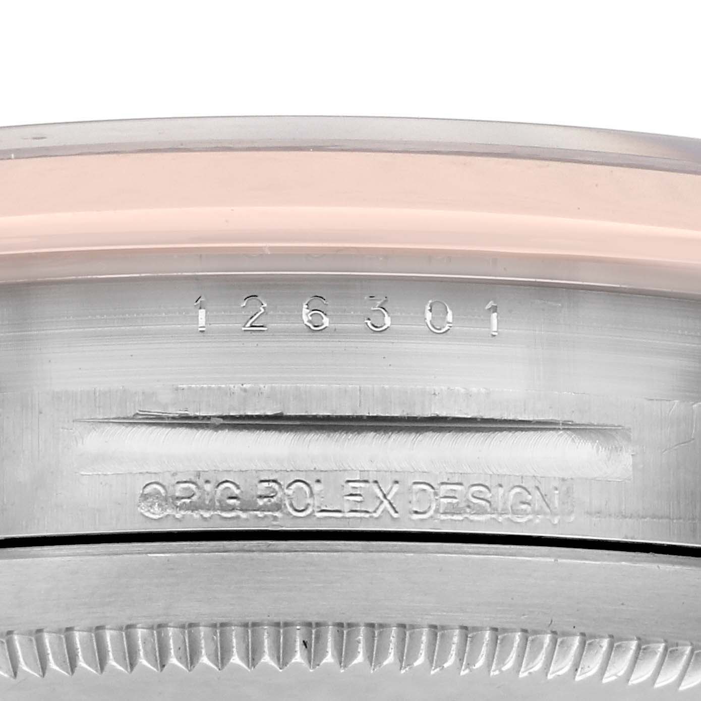 The image shows a close-up of the side of the Rolex Datejust 41 126301 Men's Steel and Gold (two tone) Pink Dial 126301 Men's Steel and Gold (two tone) Pink Dial watch case, displaying its model number and design engraving.