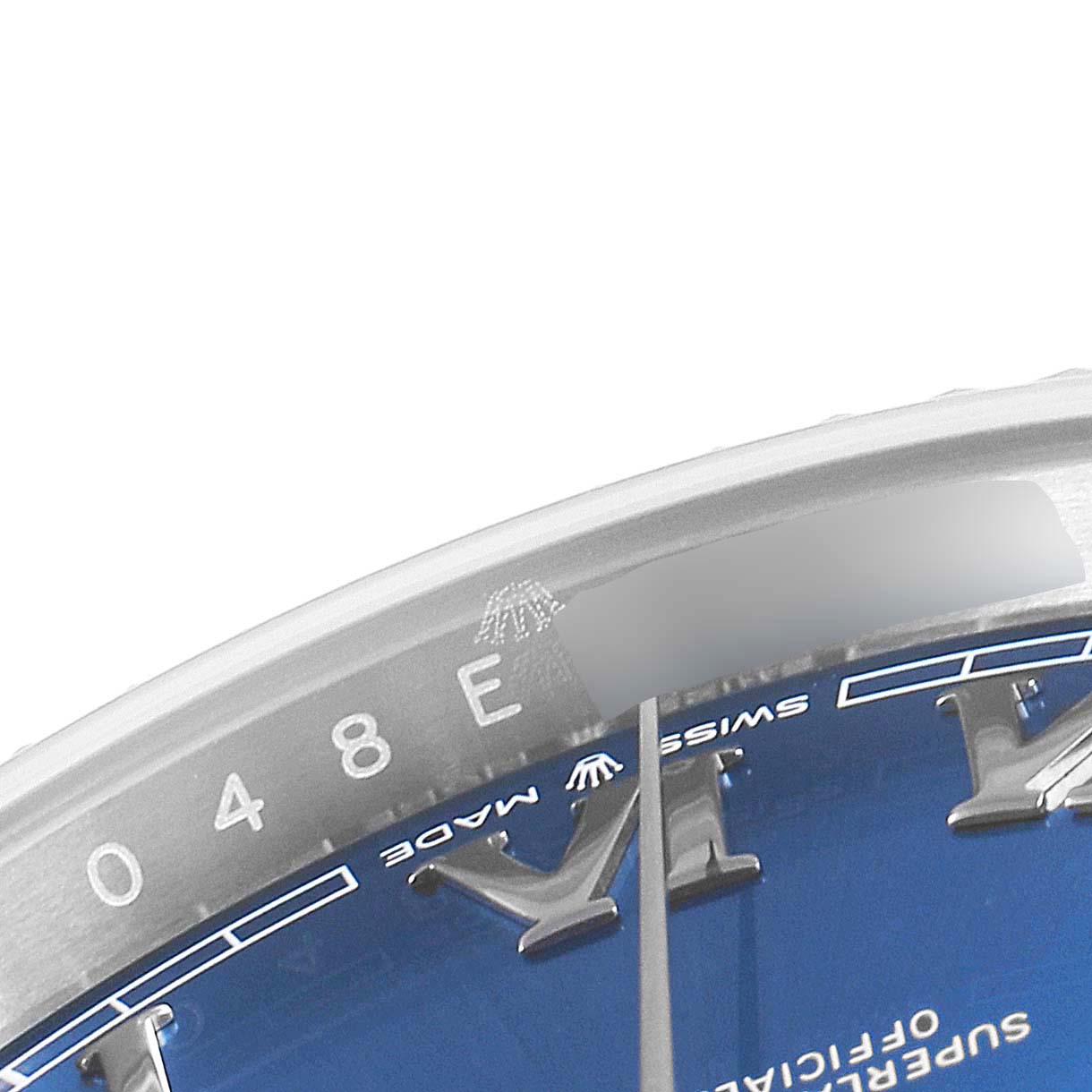 The image shows a close-up of the Rolex Datejust 41 126334 Men
s Stainless Steel Blue Dial 126334 Men
s Stainless Steel Blue Dial watch
s blue dial, bezel, and part of the minute hand.