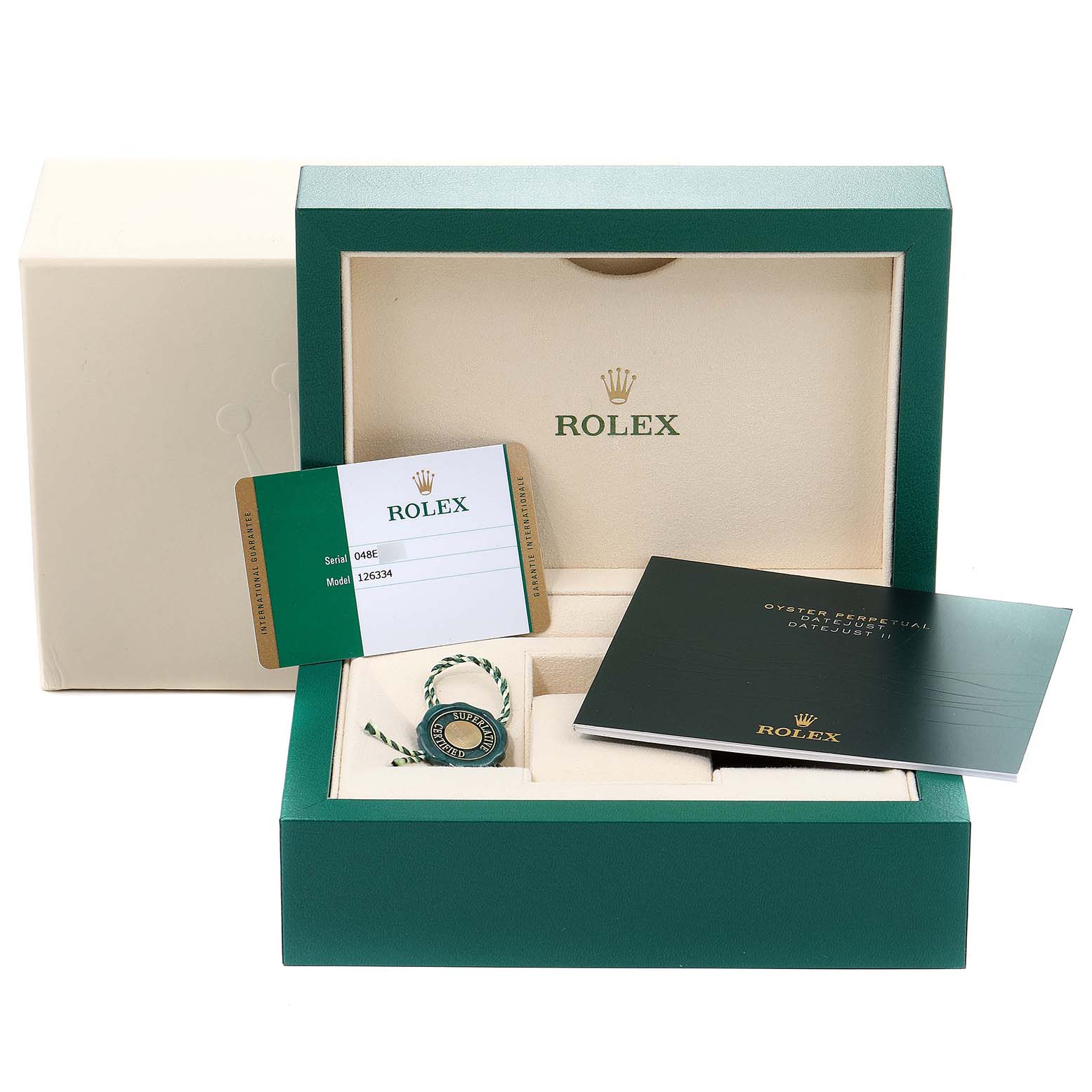 The image shows the open packaging and accessories for a Rolex Datejust 41 126334 Men
s Stainless Steel Blue Dial 126334 Men
s Stainless Steel Blue Dial watch, including the warranty card, booklet, and hangtag.