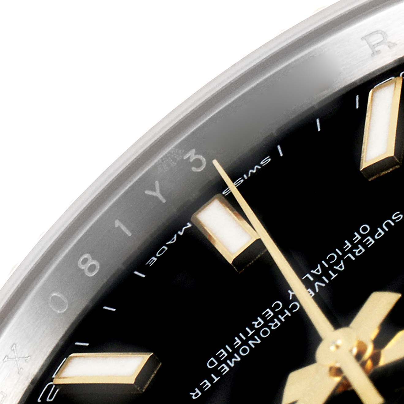 The close-up photo shows part of the bezel, dial, and hour marker of the Rolex Datejust 41 126333 Men's Steel and Gold (two tone) Black Dial 126333 Men's Steel and Gold (two tone) Black Dial watch.