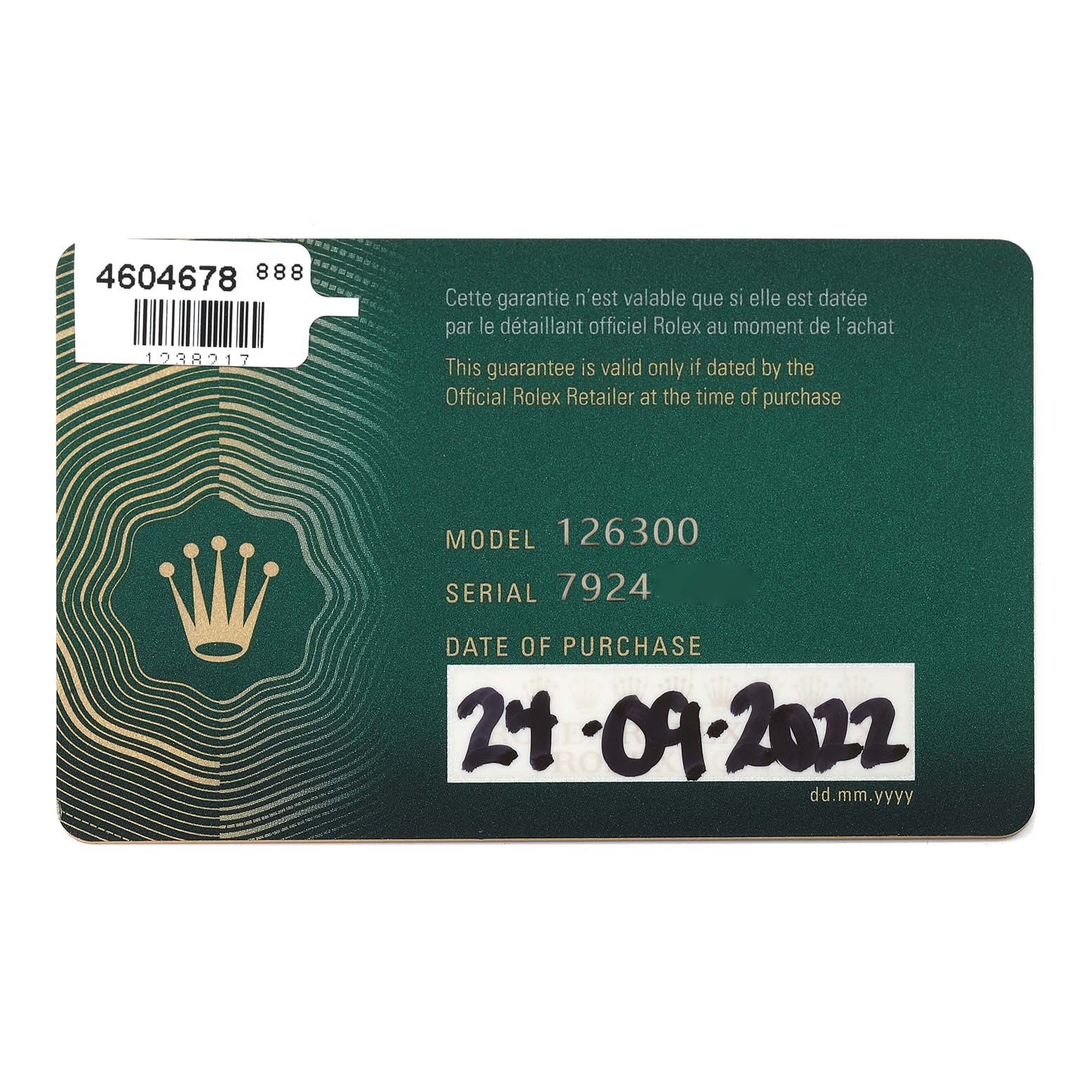This image shows a green warranty card for the Rolex Datejust 41 126300 Men's Stainless Steel White Dial 126300 Men's Stainless Steel White Dial model 126300, with a handwritten date of purchase.