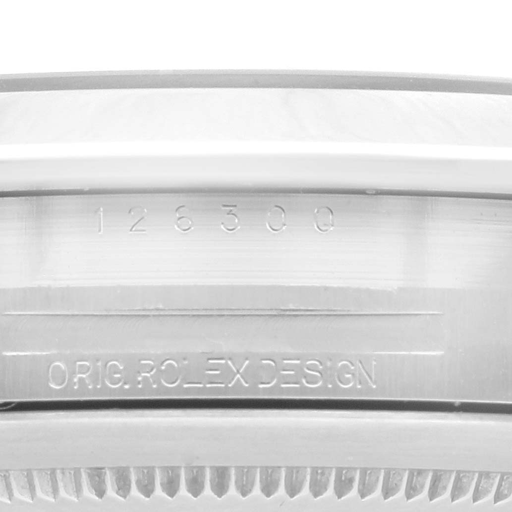 This image shows a close-up view of the engravings on the side of the case of a Rolex Datejust 41 126300 Men
s Stainless Steel White Dial 126300 Men
s Stainless Steel White Dial.