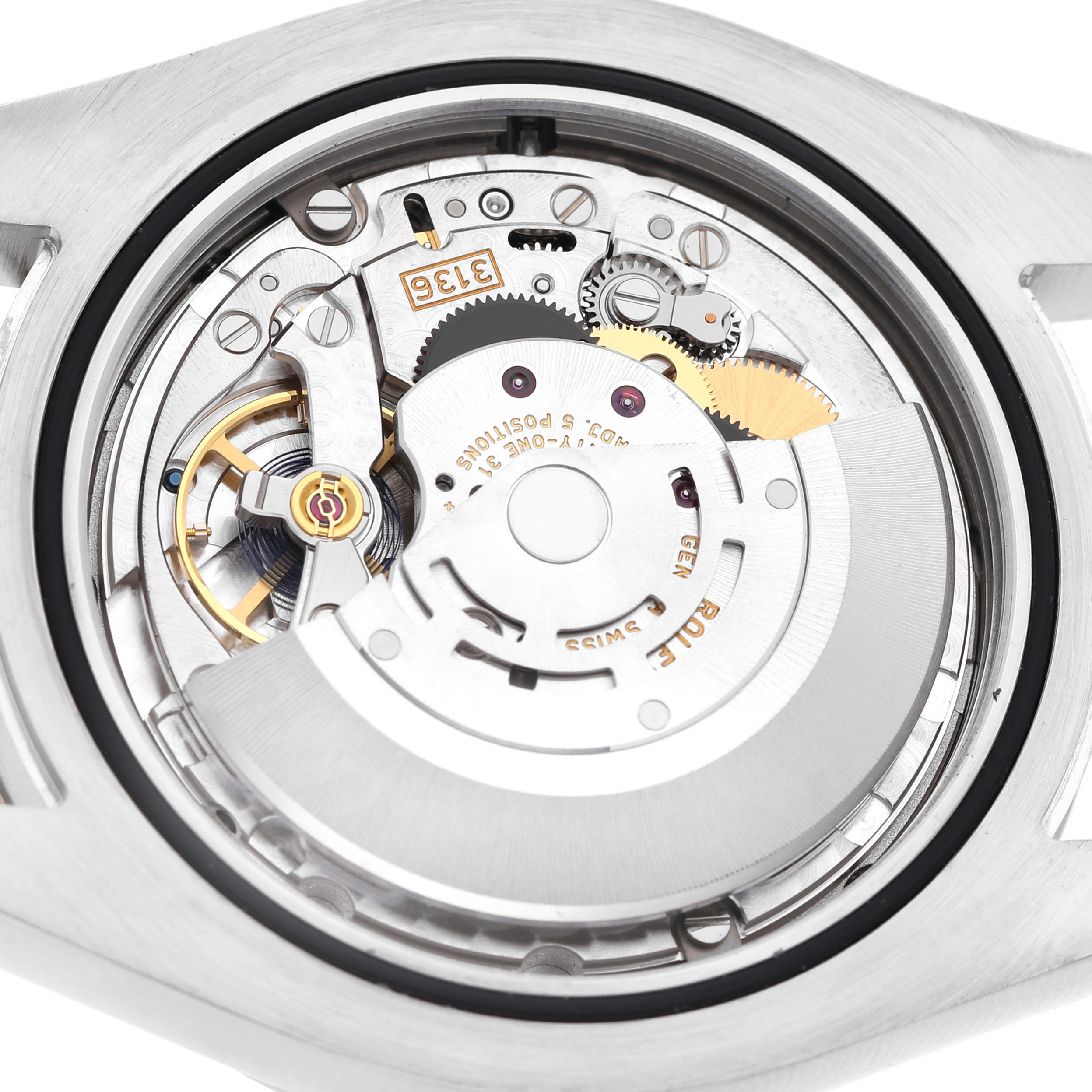 The image shows the Rolex Datejust 41 116334 Men's Stainless Steel White Dial's movement from the rear, highlighting the intricate mechanical components.