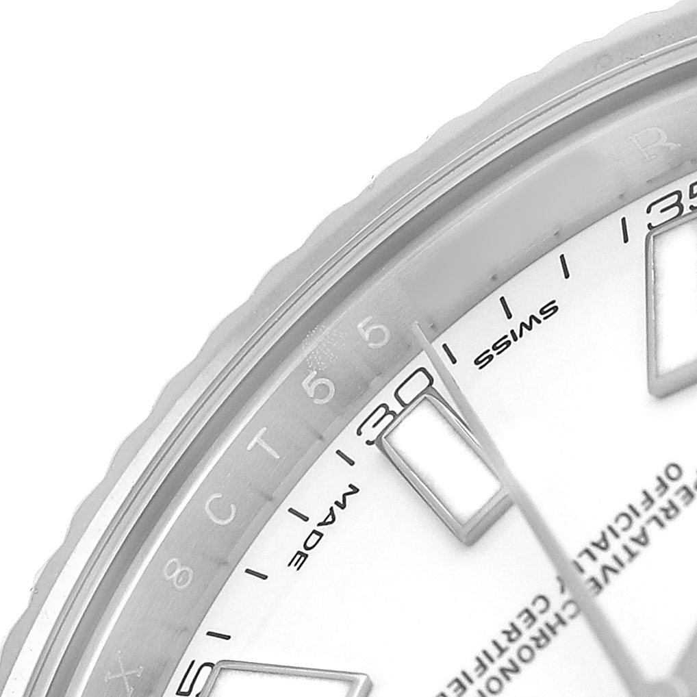 The image shows a close-up of the dial and part of the bezel of a Rolex Datejust 41 116334 Men's Stainless Steel White Dial, including hour markers and part of the text.