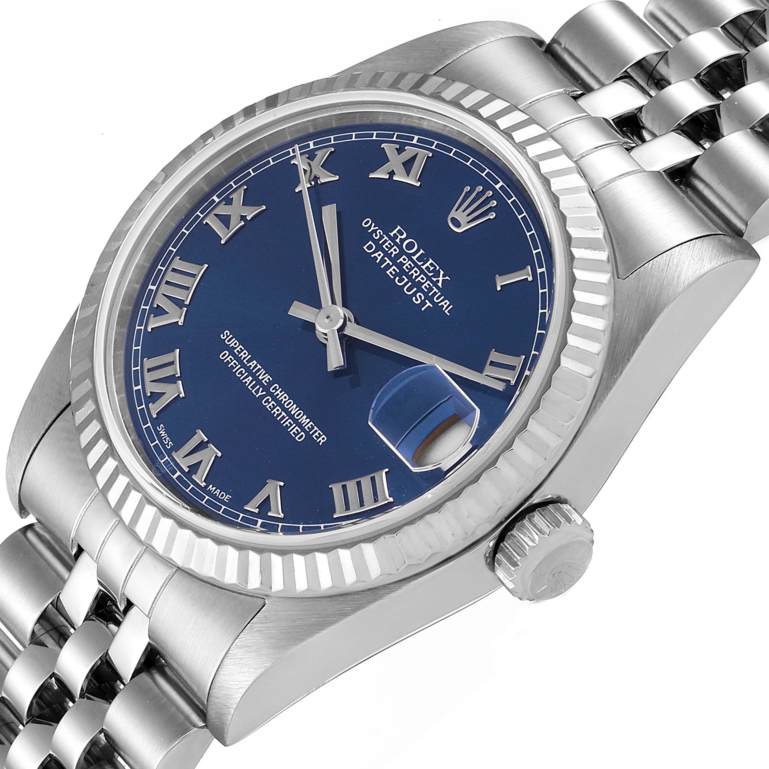 The image shows a Rolex Datejust Mid-Size watch at a slight angle highlighting the bezel, crown, and part of the bracelet.