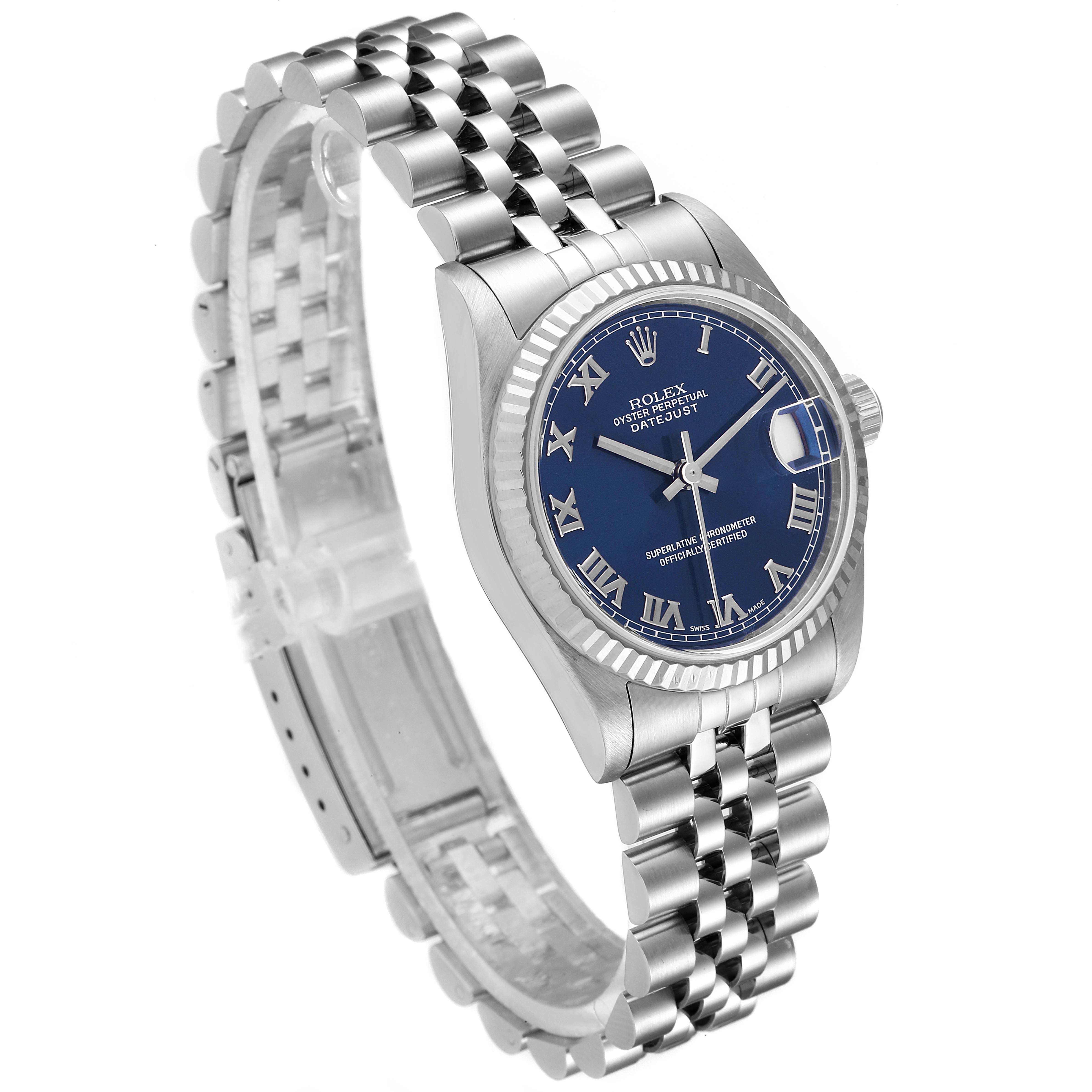 This image shows a Rolex Mid-Size 78274 Women's Stainless Steel Blue Dial 78274 Women's Stainless Steel Blue Dial Datejust watch from a side angle, highlighting its blue dial and Jubilee bracelet.