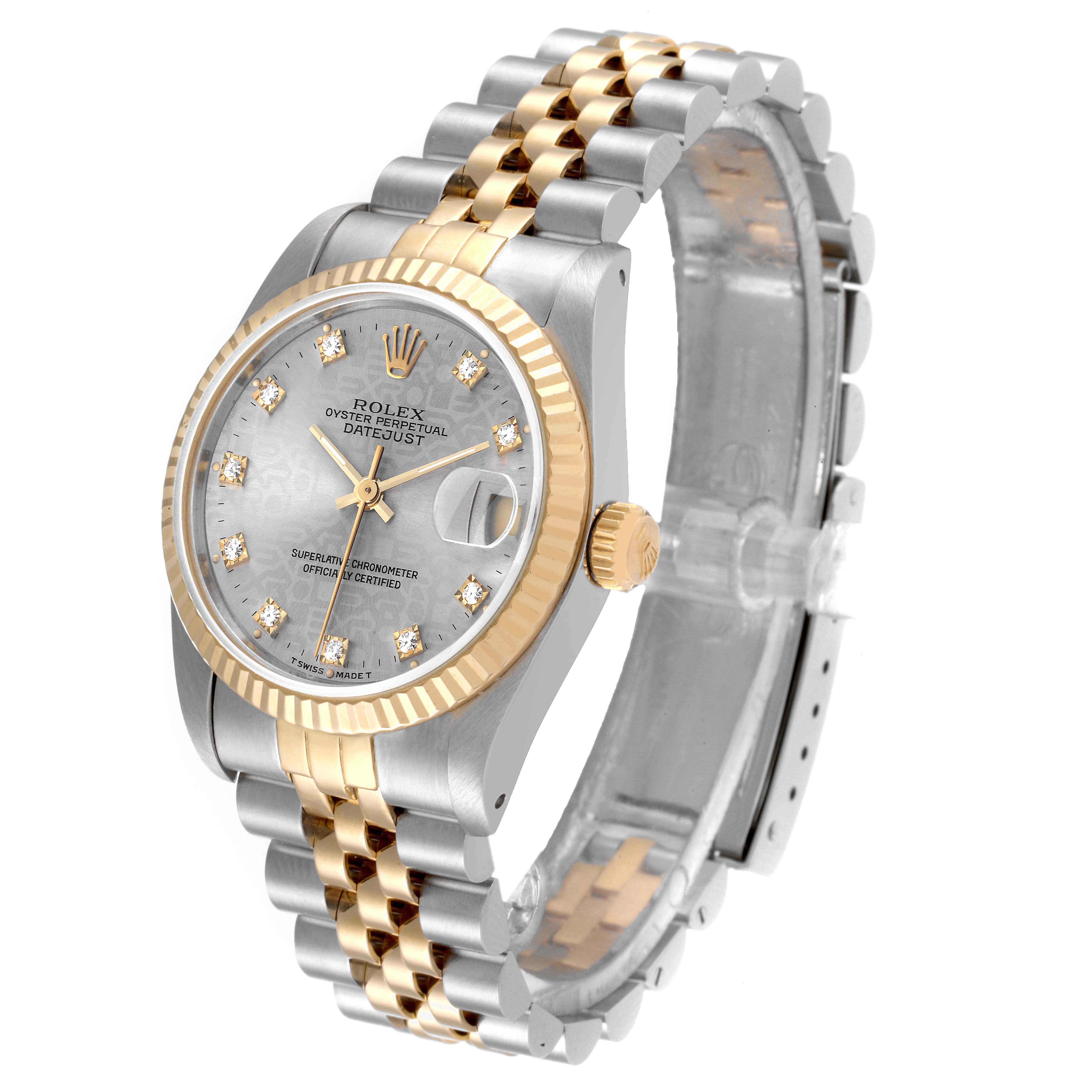 The Rolex Mid-Size 68273 Women
s Steel and Gold (two tone) Silver Dial 68273 Women
s Steel and Gold (two tone) Silver Dial Datejust watch is shown at an angle highlighting its face, fluted bezel, and two-tone bracelet.
