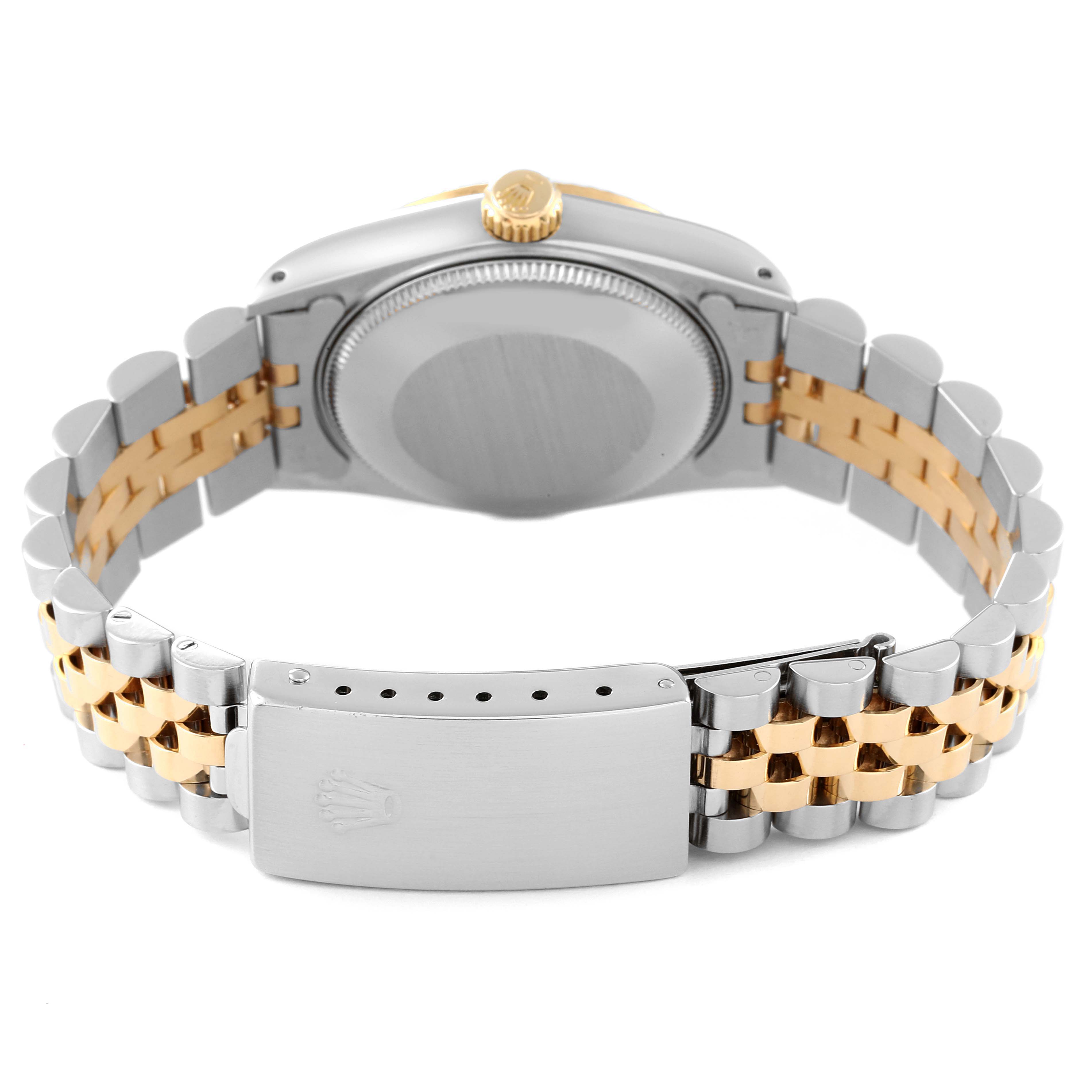The image shows the back case and bracelet clasp of a Rolex Mid-Size 68273 Women
s Steel and Gold (two tone) Silver Dial 68273 Women
s Steel and Gold (two tone) Silver Dial model watch, showcasing its two-tone metal design.