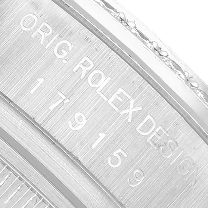 The image shows the engraved side of a Rolex President 179159 Women's White Gold Mother of Pearl Dial model watch, highlighting the design and serial numbers.