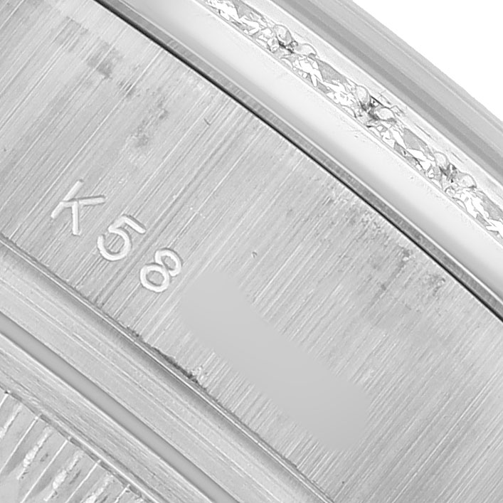 The image shows a close-up of the inner case with engraving on a Rolex President 179159 Women's White Gold Mother of Pearl Dial model watch.