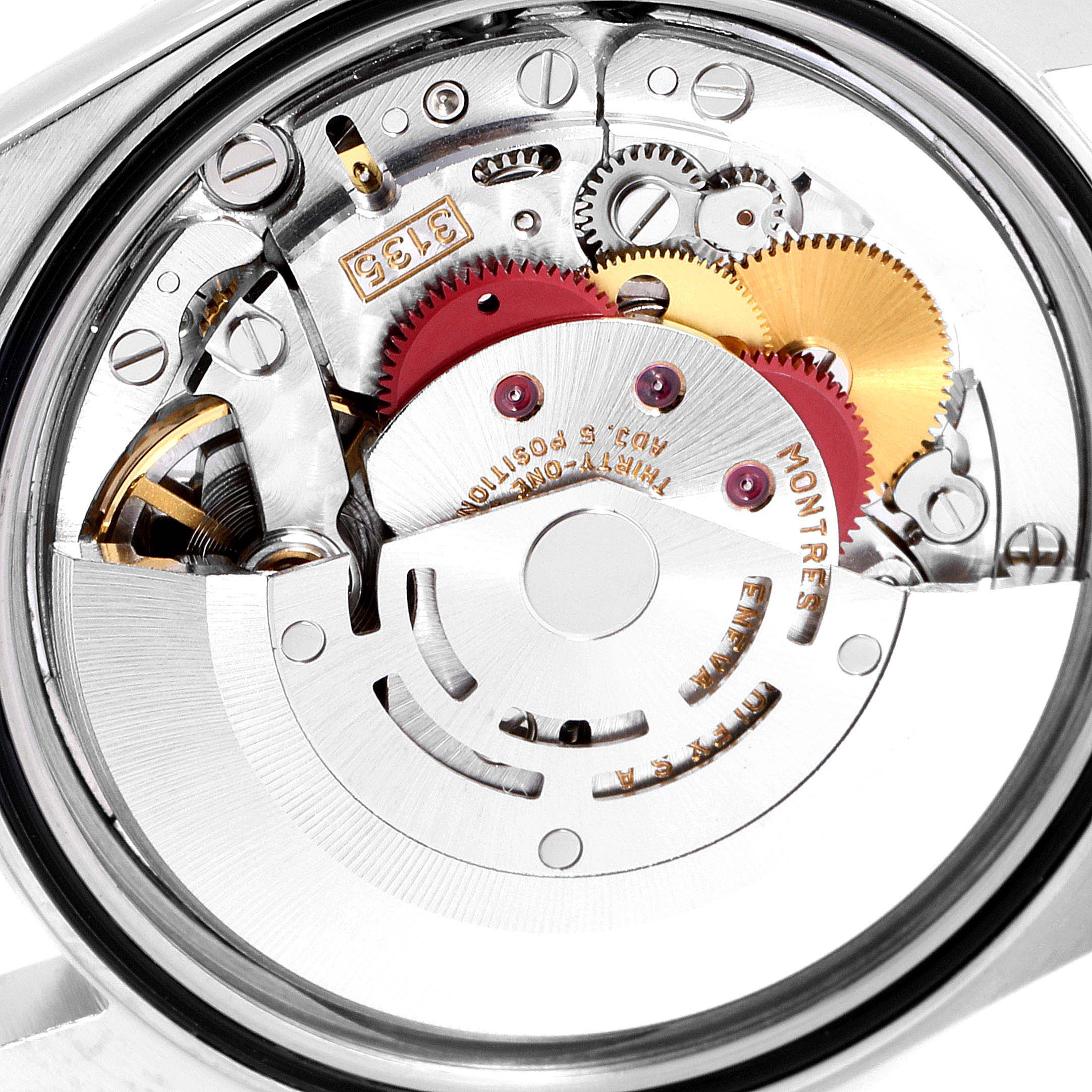 This image shows the inner mechanical movement of a Rolex Datejust 16233G Men's Steel and Gold (two tone) Silver Dial 16233G Men's Steel and Gold (two tone) Silver Dial watch, highlighting its gears and intricate components.