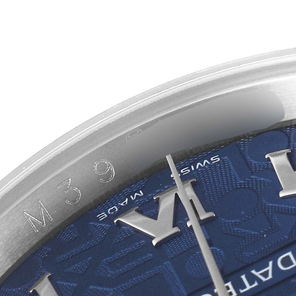 The image shows a close-up of the Rolex Datejust 116234 Men's Stainless Steel Blue Dial 116234 Men's Stainless Steel Blue Dial watch dial and part of the bezel with the engraving "M 39".