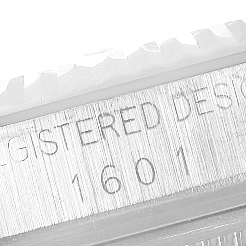 A close-up of the model number "1601" and bezel edge of a Rolex Vintage Collection 1601 Men's Stainless Steel Grey Dial 1601 Men's Stainless Steel Grey Dial watch.