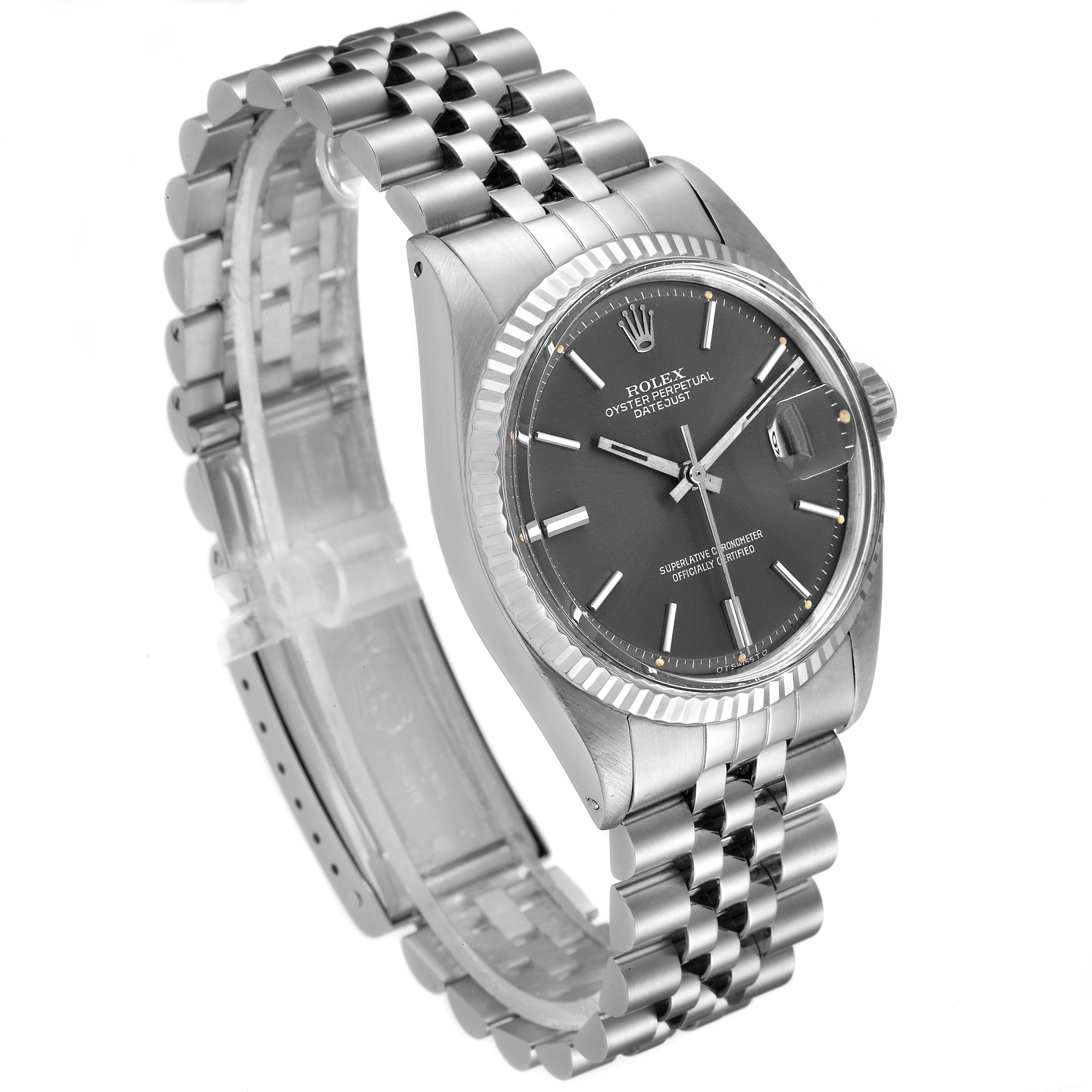 This image shows a side angle of the Rolex Vintage Collection 1601 Men's Stainless Steel Grey Dial 1601 Men's Stainless Steel Grey Dial watch, highlighting its black dial, fluted bezel, and jubilee bracelet.