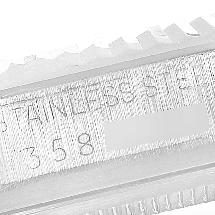 The image shows a close-up of the stainless steel case, including the serial number, of a Vintage Collection watch by Rolex.