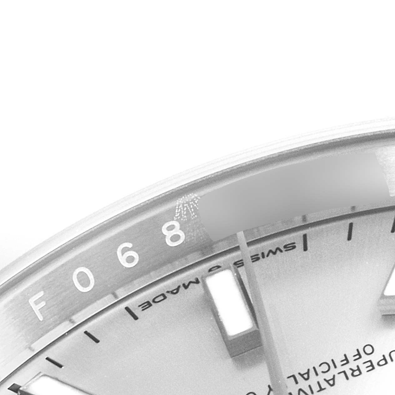 The image shows a close-up of the dial and rehaut of a Rolex Datejust 126234 Men's Stainless Steel Silver Dial 126234 Men's Stainless Steel Silver Dial watch, highlighting the minute markers and printed text.